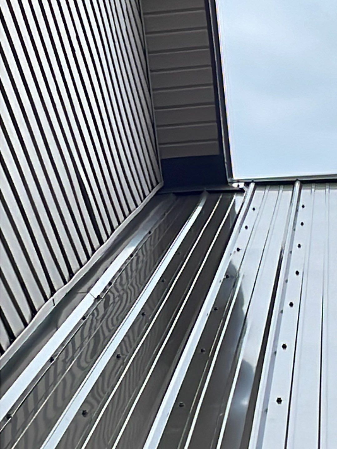 Residential Roofing Installation using Performance Panel Metal - Burnished Slate by RoofX 