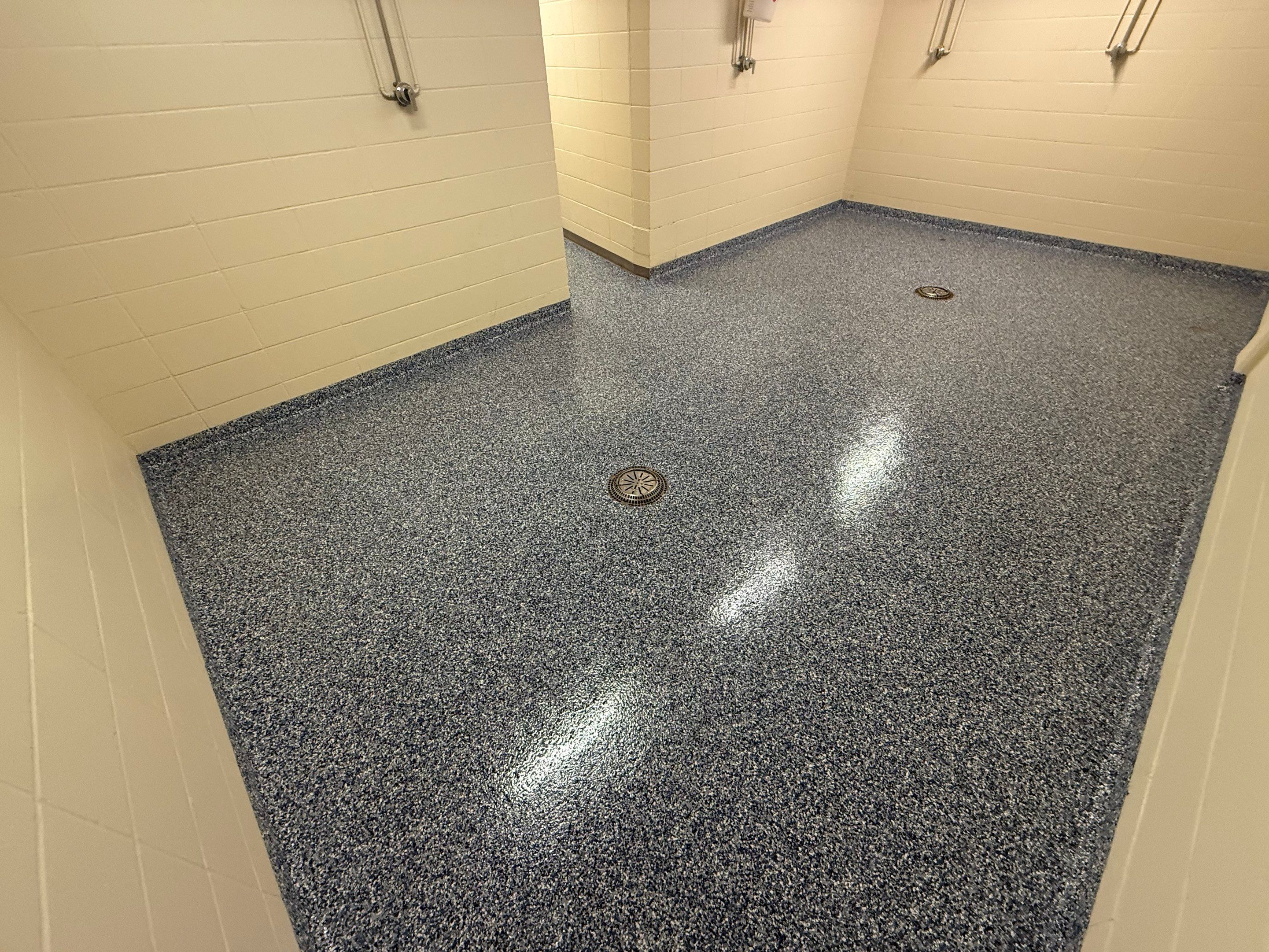 Seamless Epoxy Floor Coating at the Sioux Falls Canaries Facility by Select Painting, Coatings & Garage Cabinets