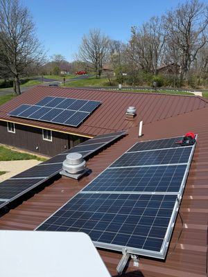 Brown R-Panel metal roof with solar