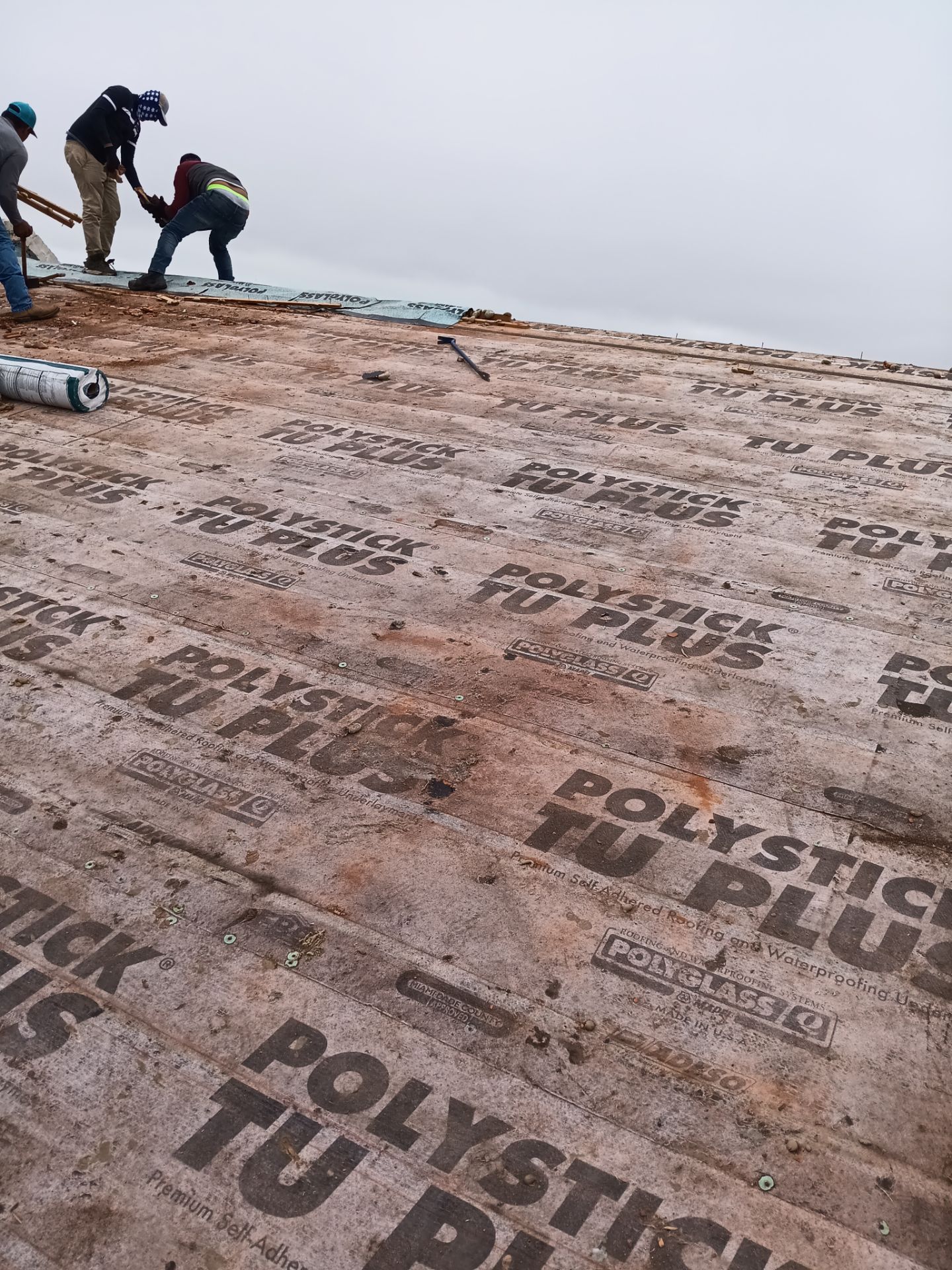 Off with the Tile and on with the TILCOR stone coated metal.  by Bayfront Roofing and Construction