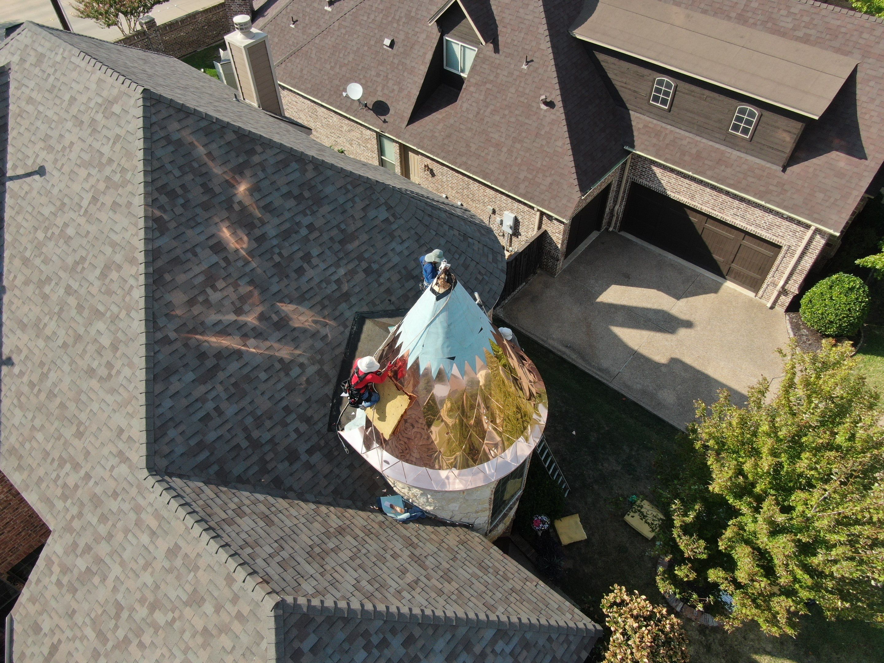 Installing Custom copper turret and Malarkey Vista Class 4 shingles Hail Damage Upgrade by Becker Roofing and Exteriors