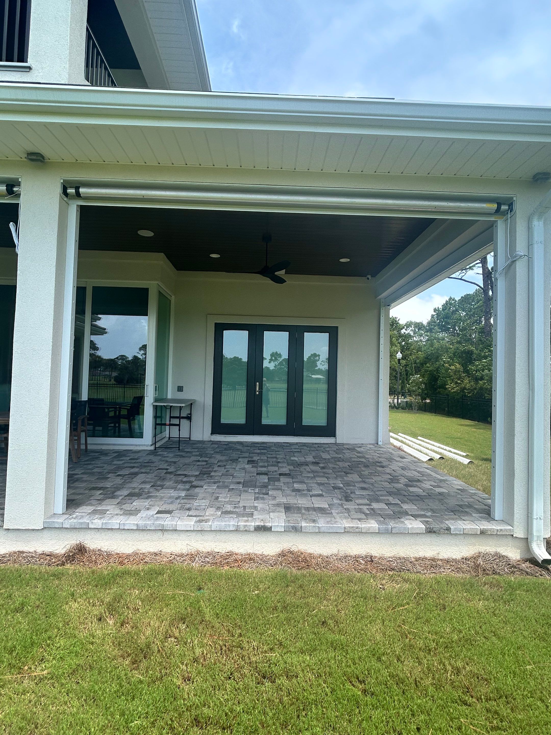 Motorized Screen and Solar Shade Installation in Panama City Beach by Brannan Aluminum Inc.