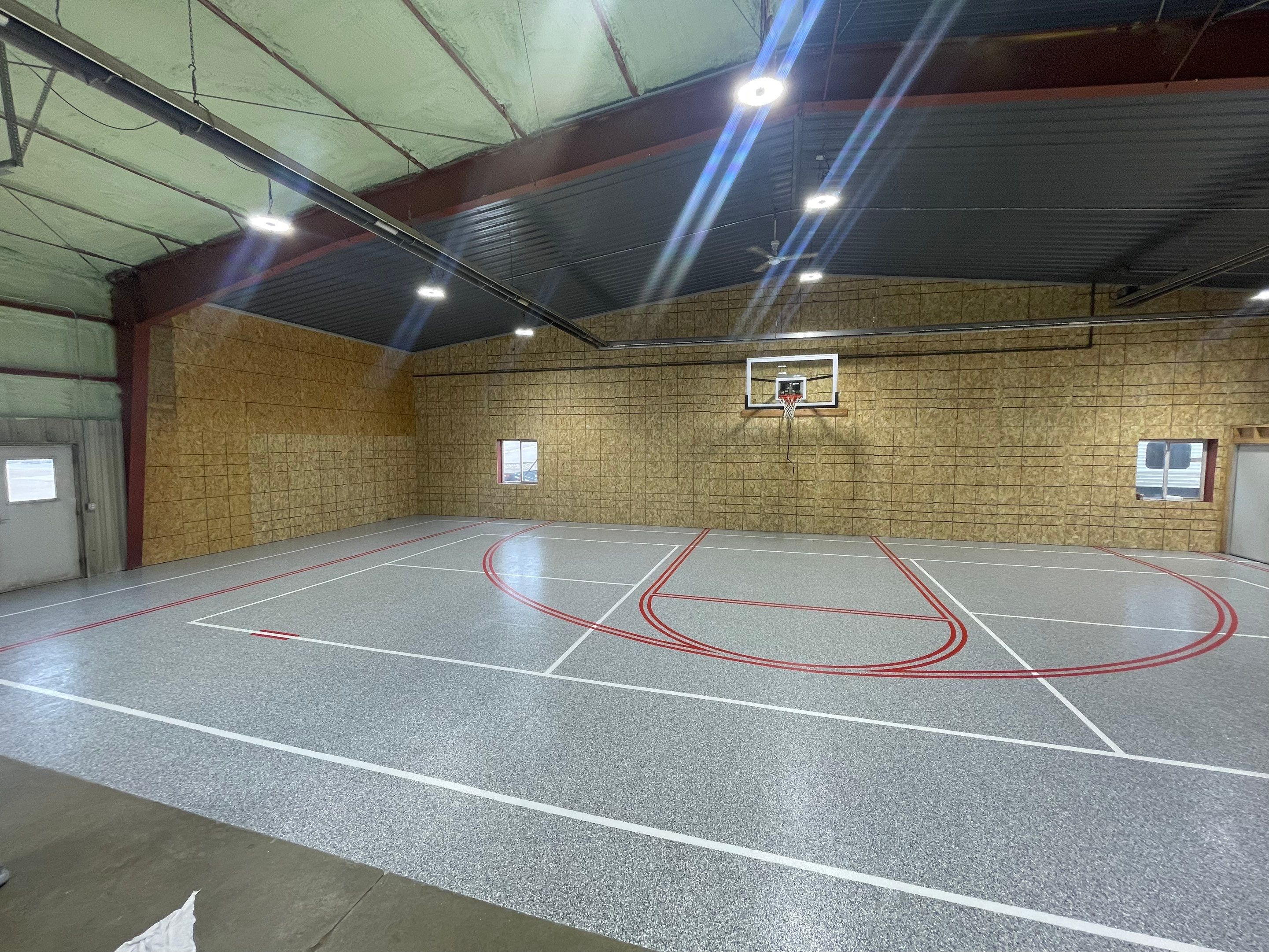 Custom Polyurea Shop Floor with Basketball Court Lines in Rock Valley by Select Painting, Coatings & Garage Cabinets