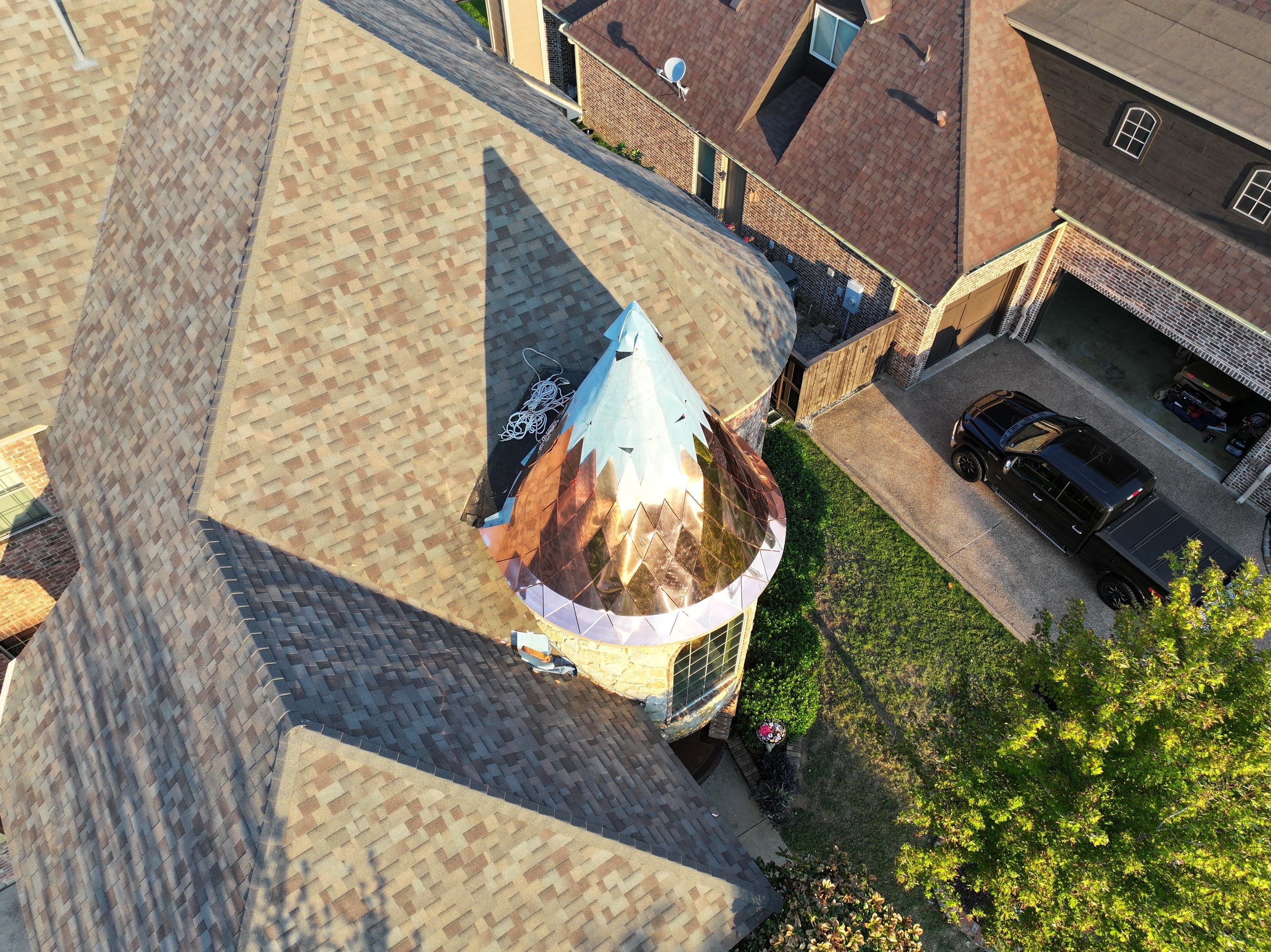 Installing Custom copper turret and Malarkey Vista Class 4 shingles Hail Damage Upgrade by Becker Roofing and Exteriors