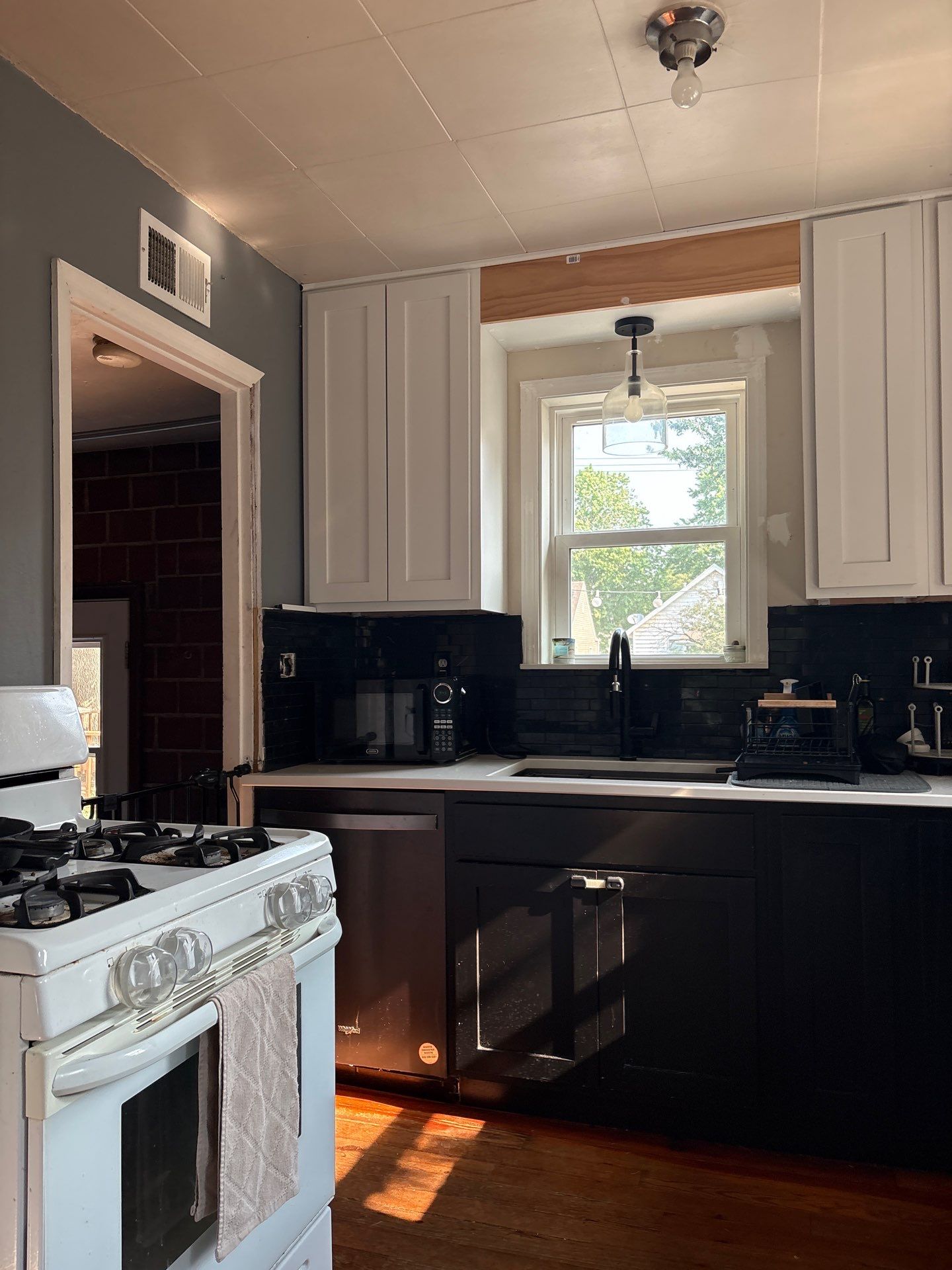 Lincoln Kitchen Remodel With Black and White Two-Tone Cabinetry by CompanyCam Sales Demo