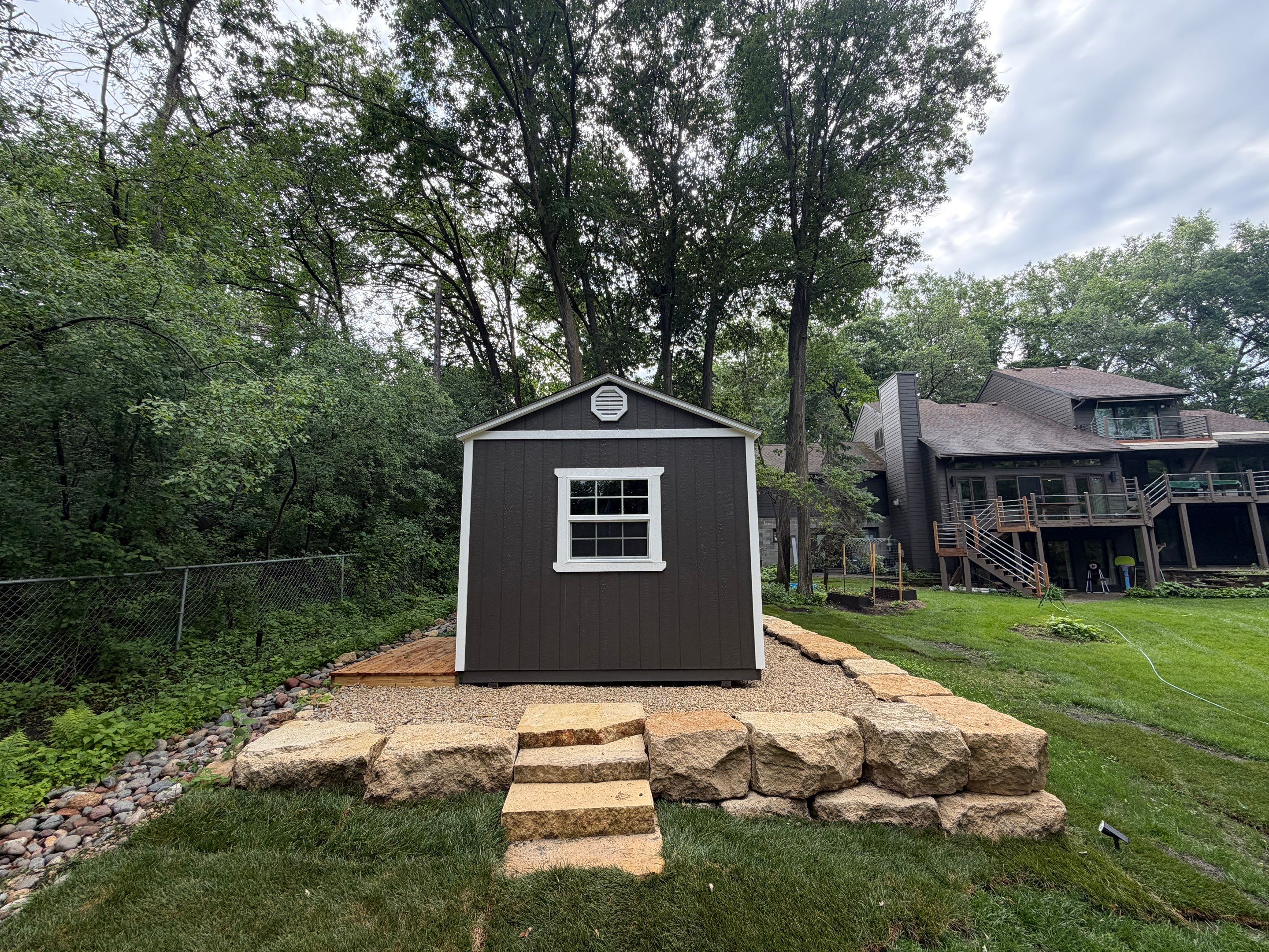 Limestone Boulder Wall  by Sota landscaping