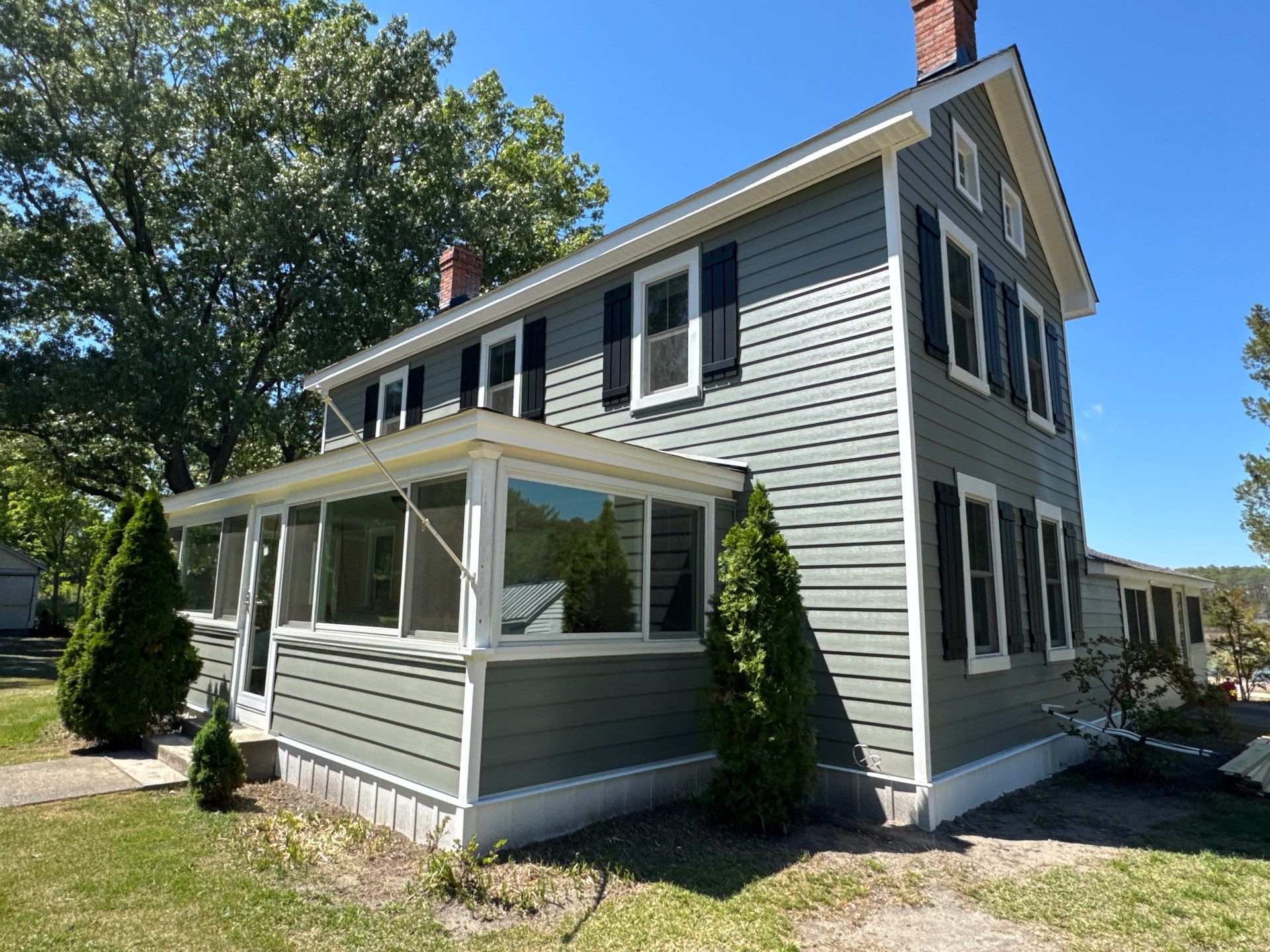 Waterfront Exterior Renovation in Port Haywood by Cade Construction