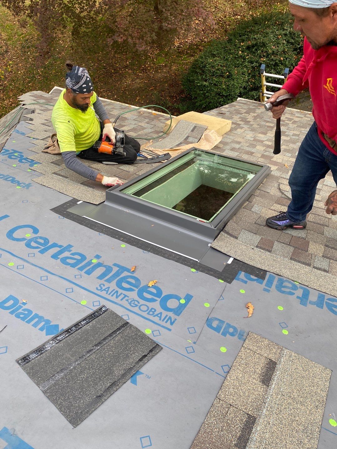 Install new shingles and new skylights  by Alpha Design Services