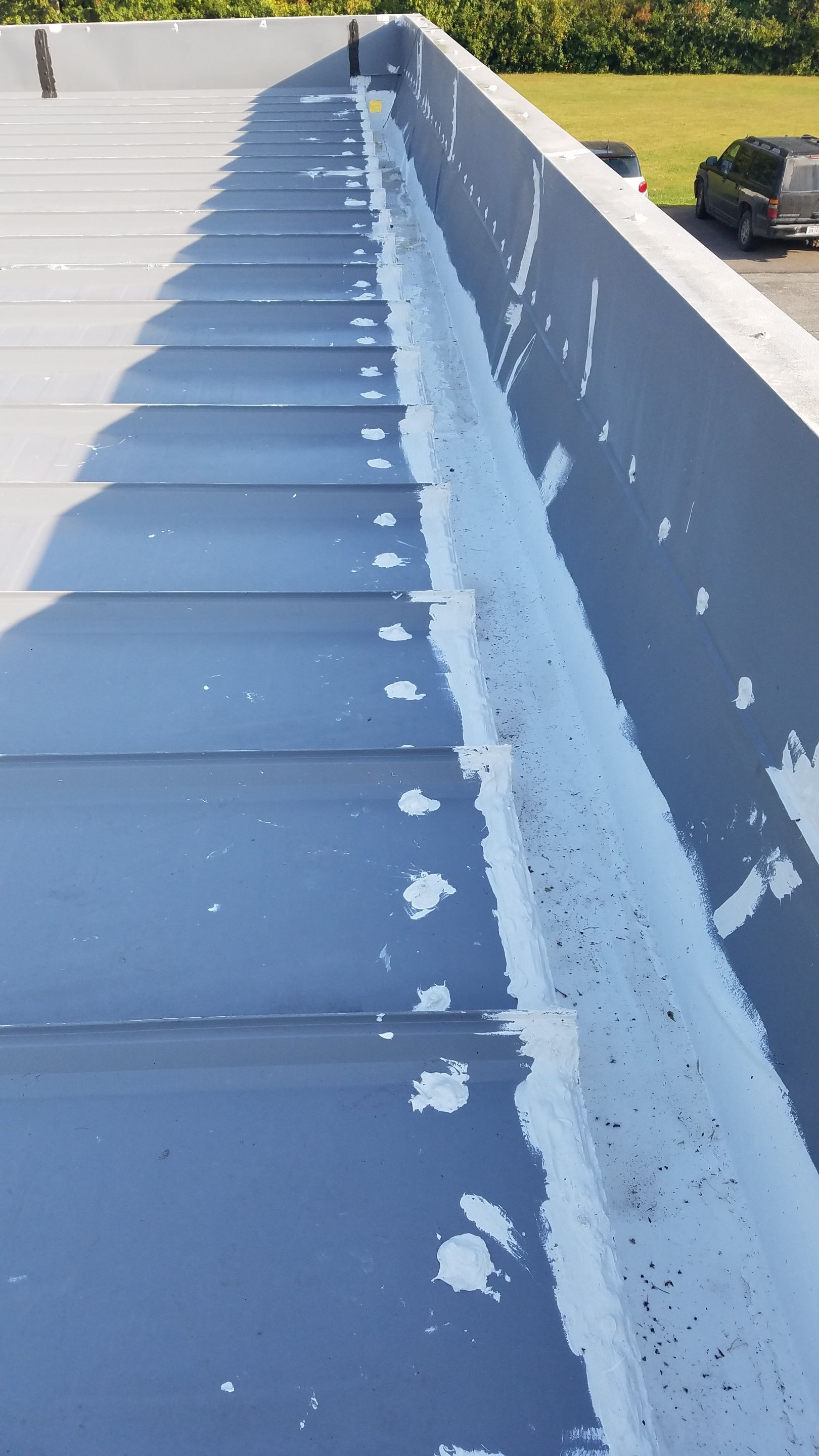 Commercial Metal Roof Coating by Gold Star Roofing LLC