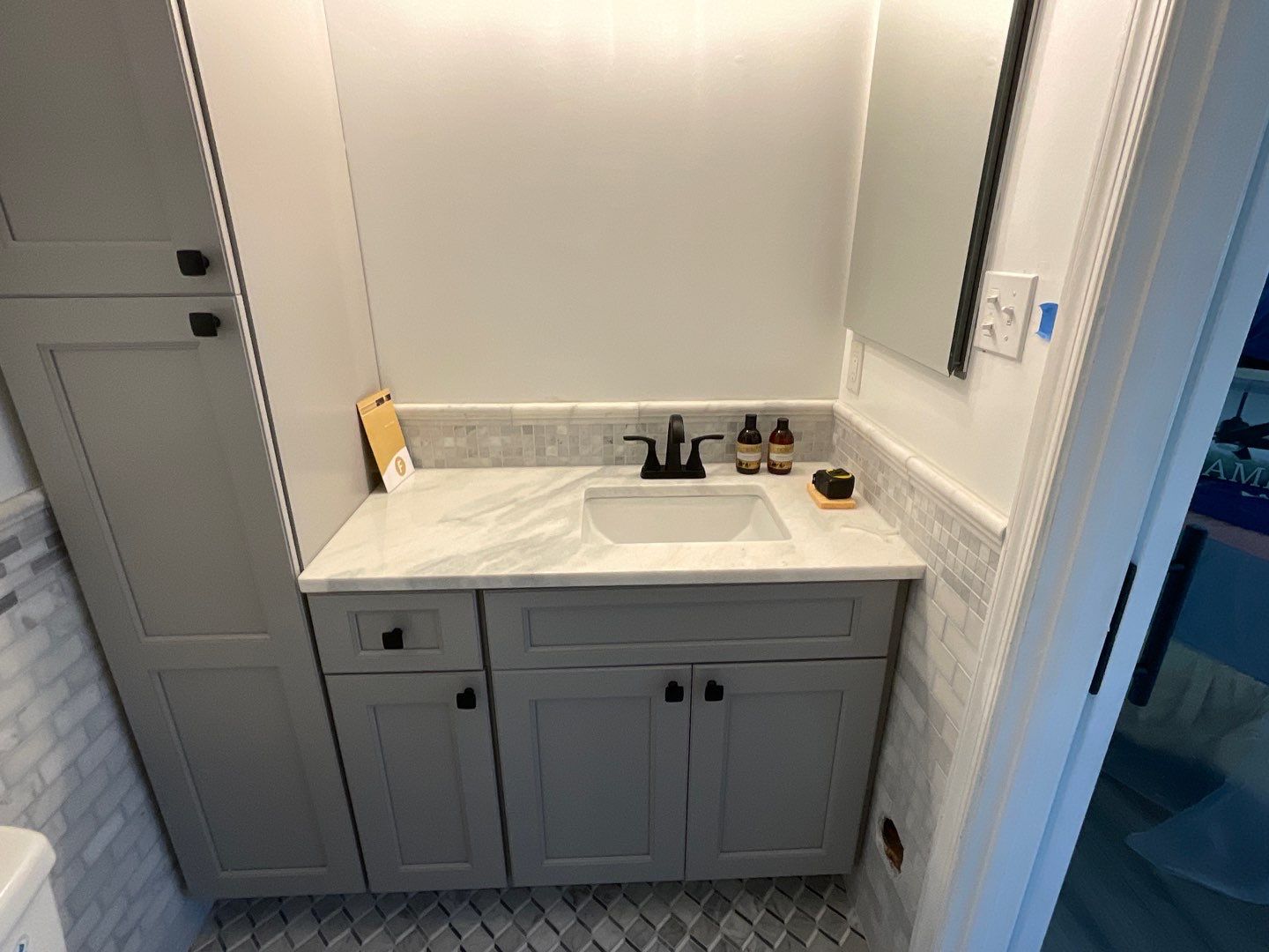 Bathroom Remodel using Two new bathroom design and new floors by Alpha Design Services