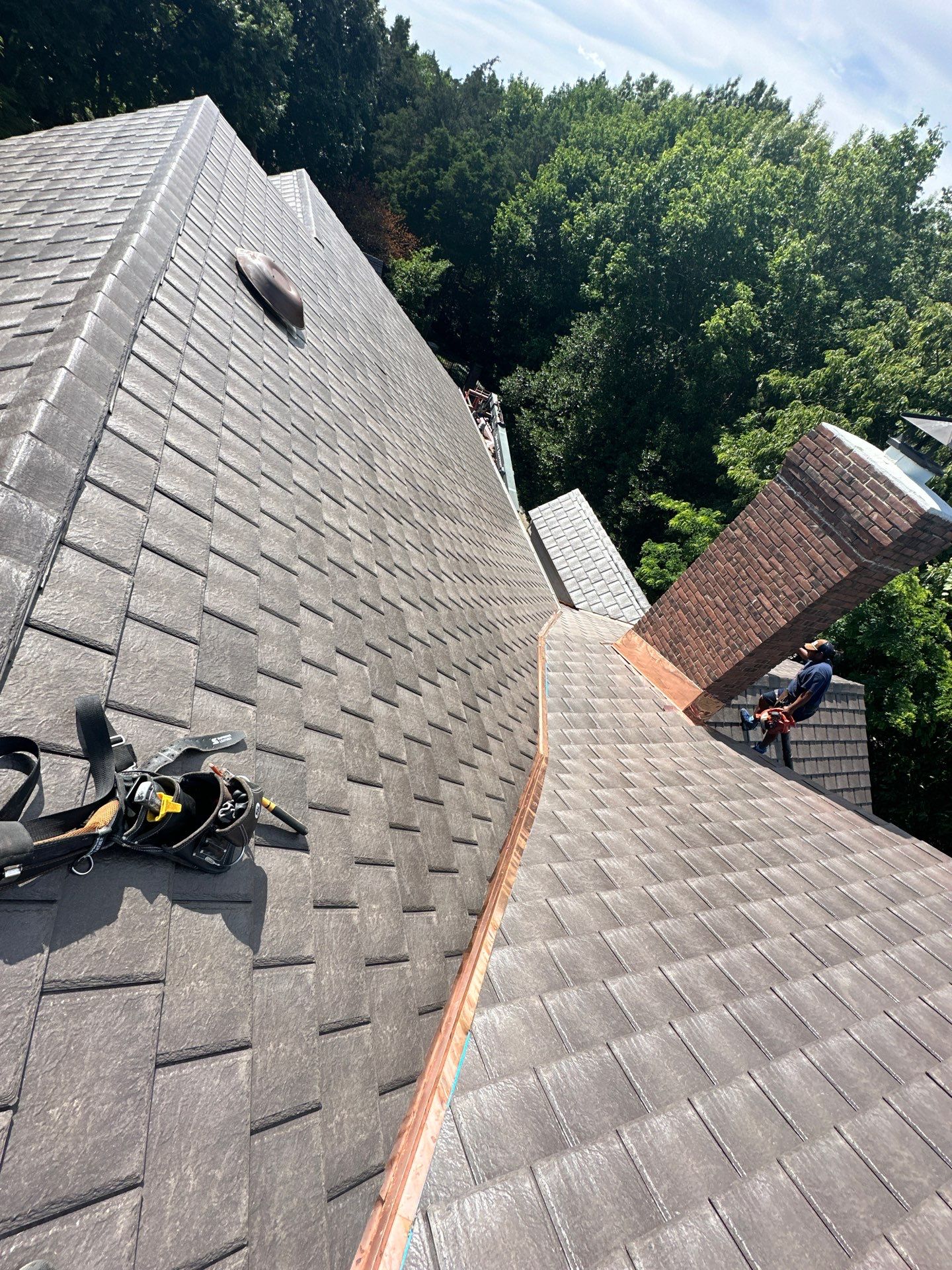 Residential Roofing Installation Using Enviroshake Synthetic Slate by Undersun Roofing 