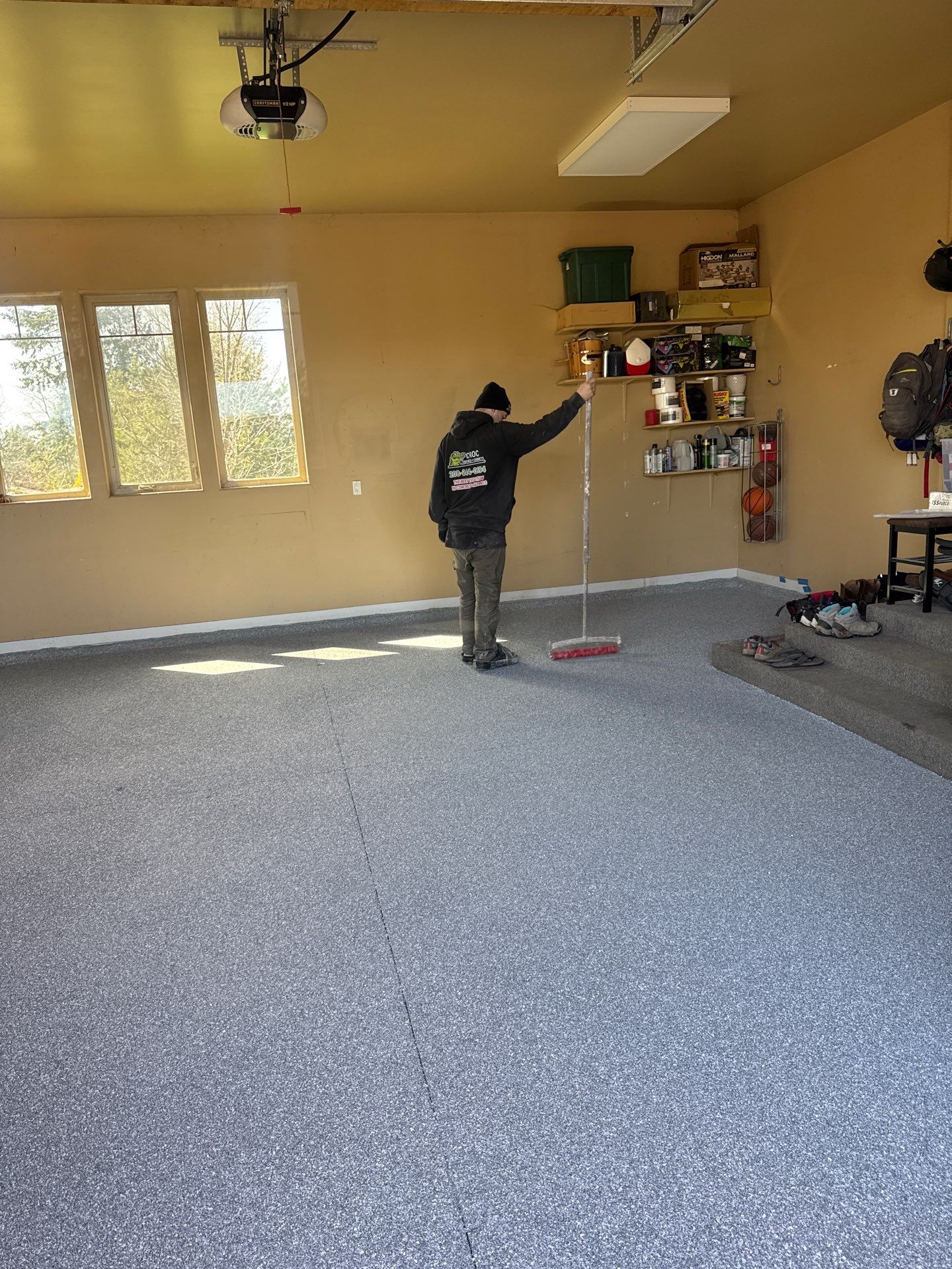 Turquoise Hybrid Polyaspartic Garage Floor Coating in Sandpoint by Croc Coatings, LLC