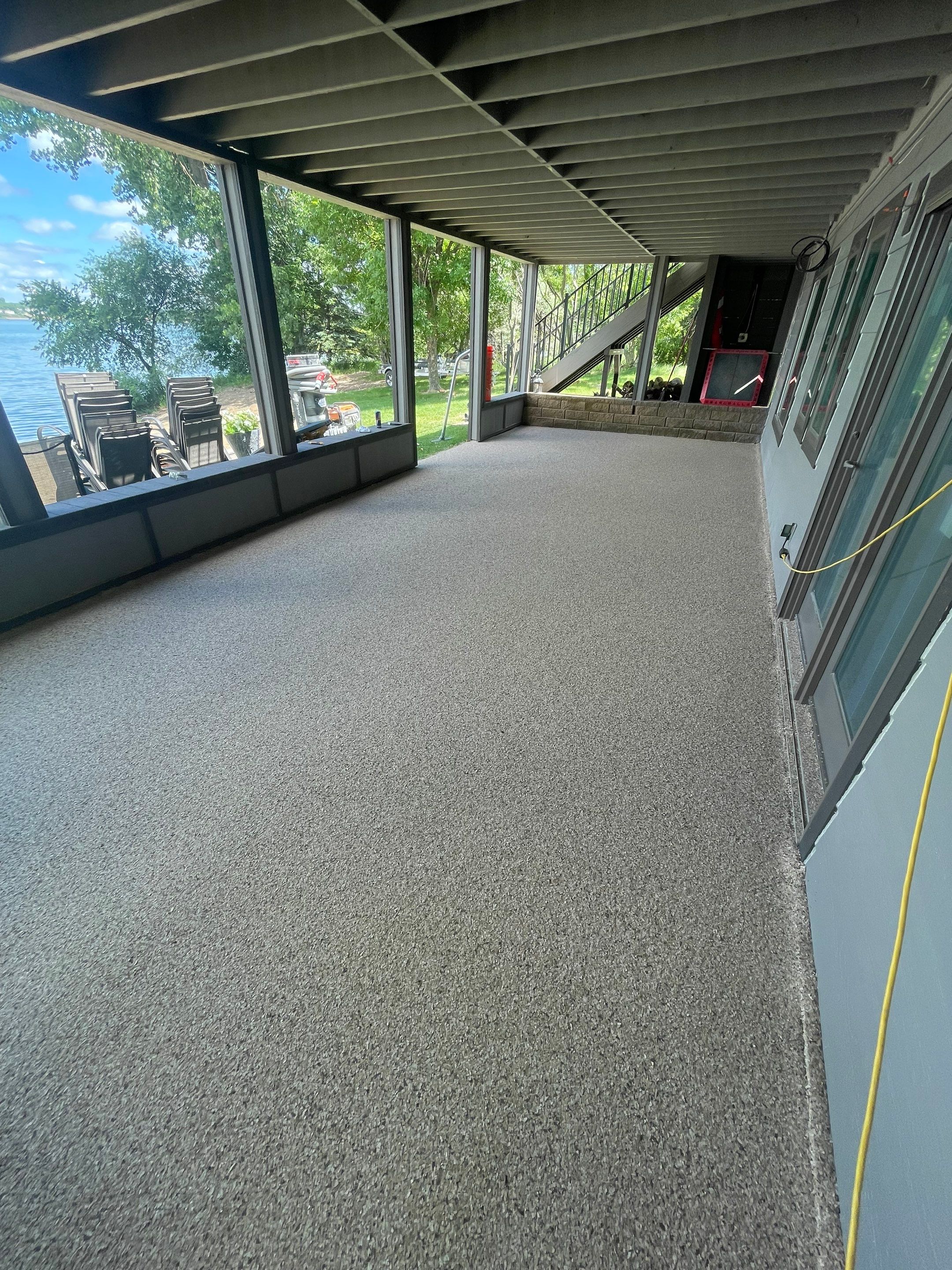 Lakefront Screened Patio Concrete Coating Installation in Wentworth by Select Painting, Coatings & Garage Cabinets