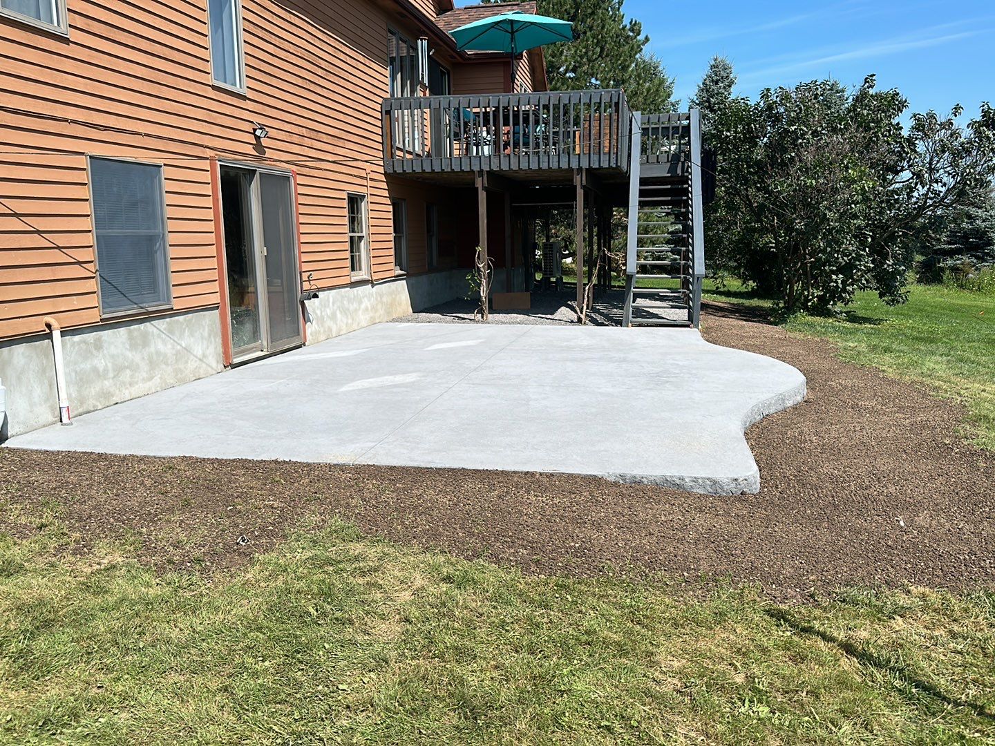 Bluestone textured concrete stamped patio  by NG Masonry & Construction LLC