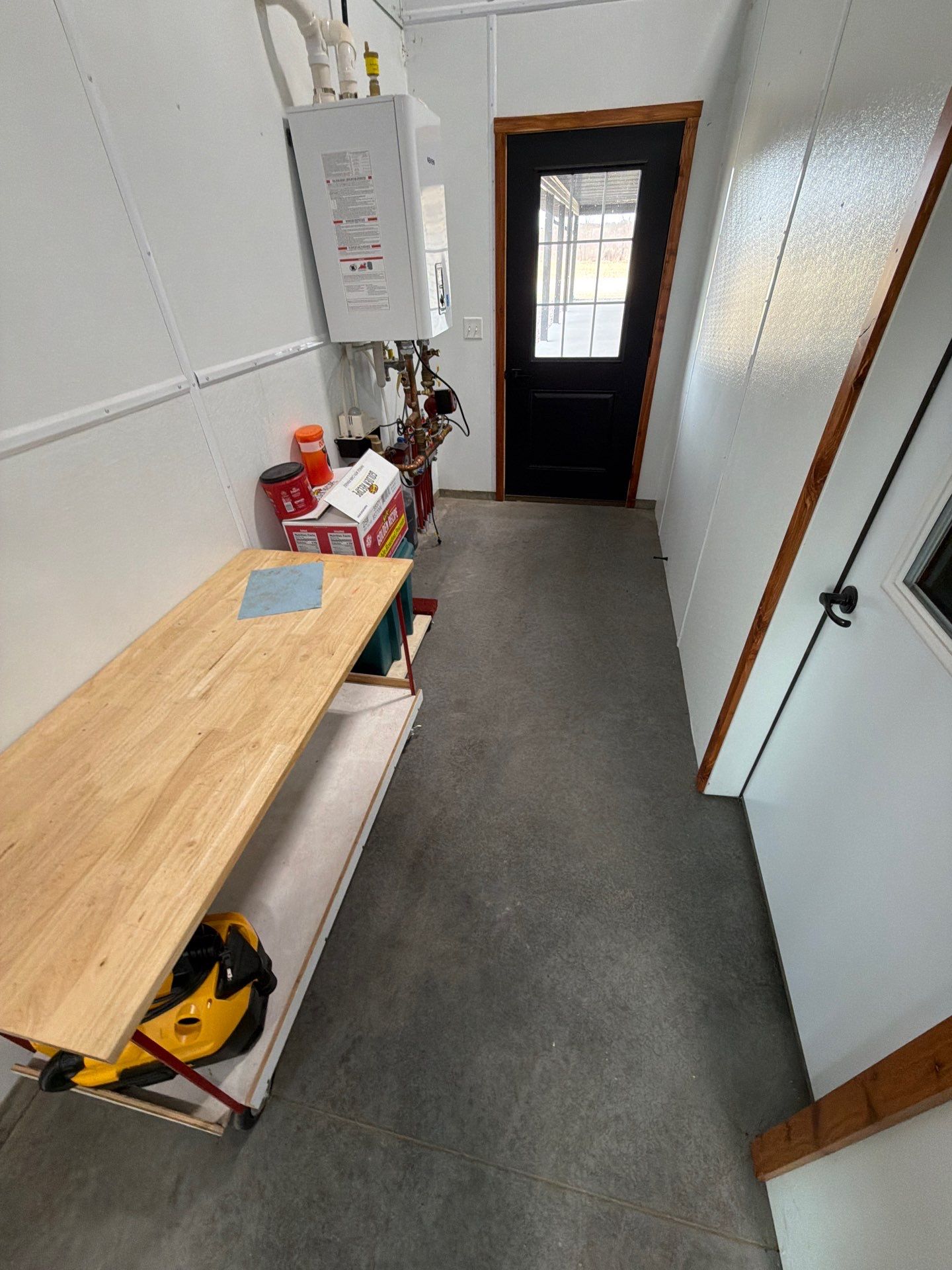 Multi-Stage Concrete Floor Coating for Egan Shop and RV Storage by Select Painting, Coatings & Garage Cabinets