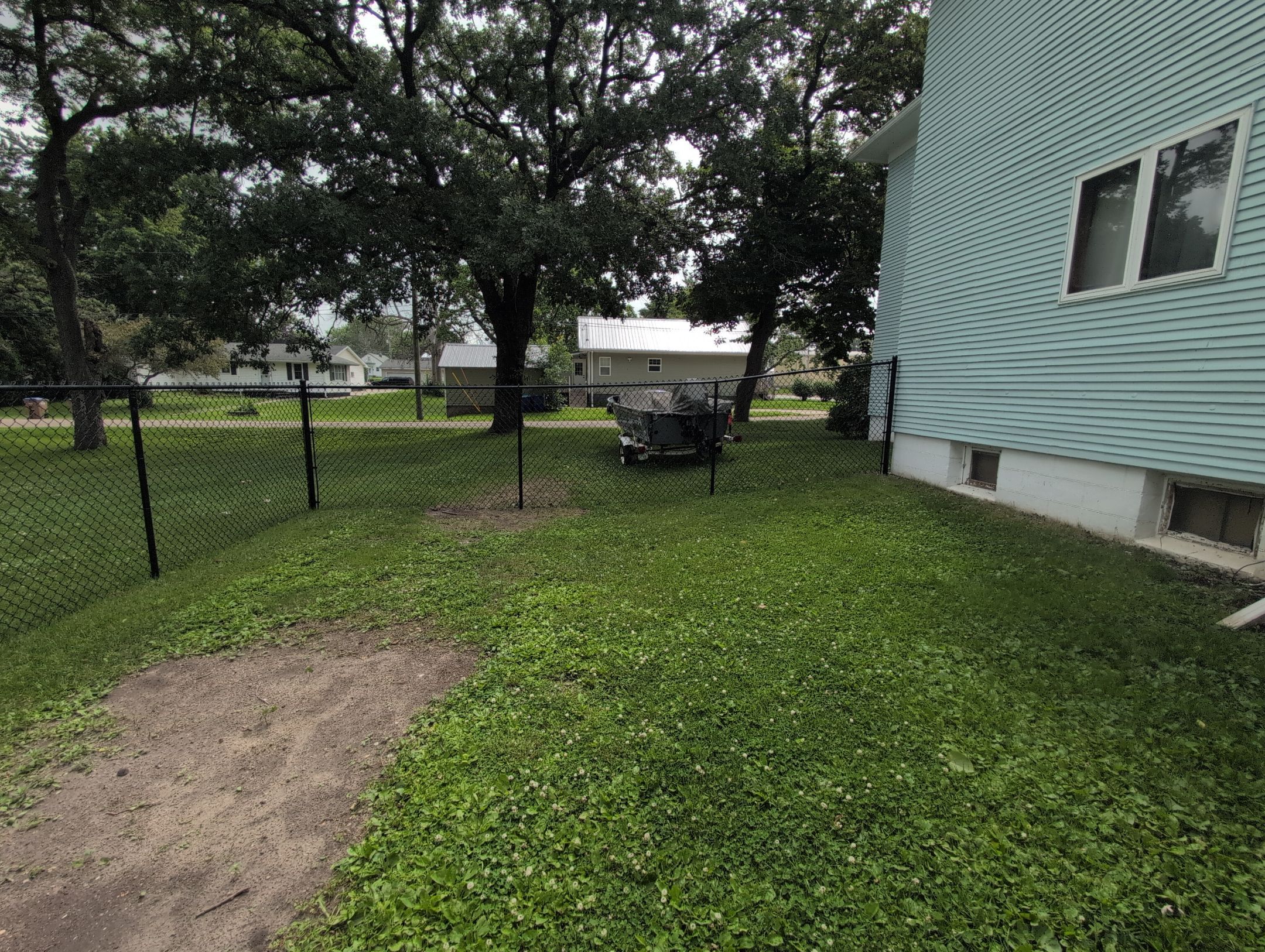 Black Vinyl Coated Chain Link Fence Installation in Independence by Perfect Picket Fence and Stain