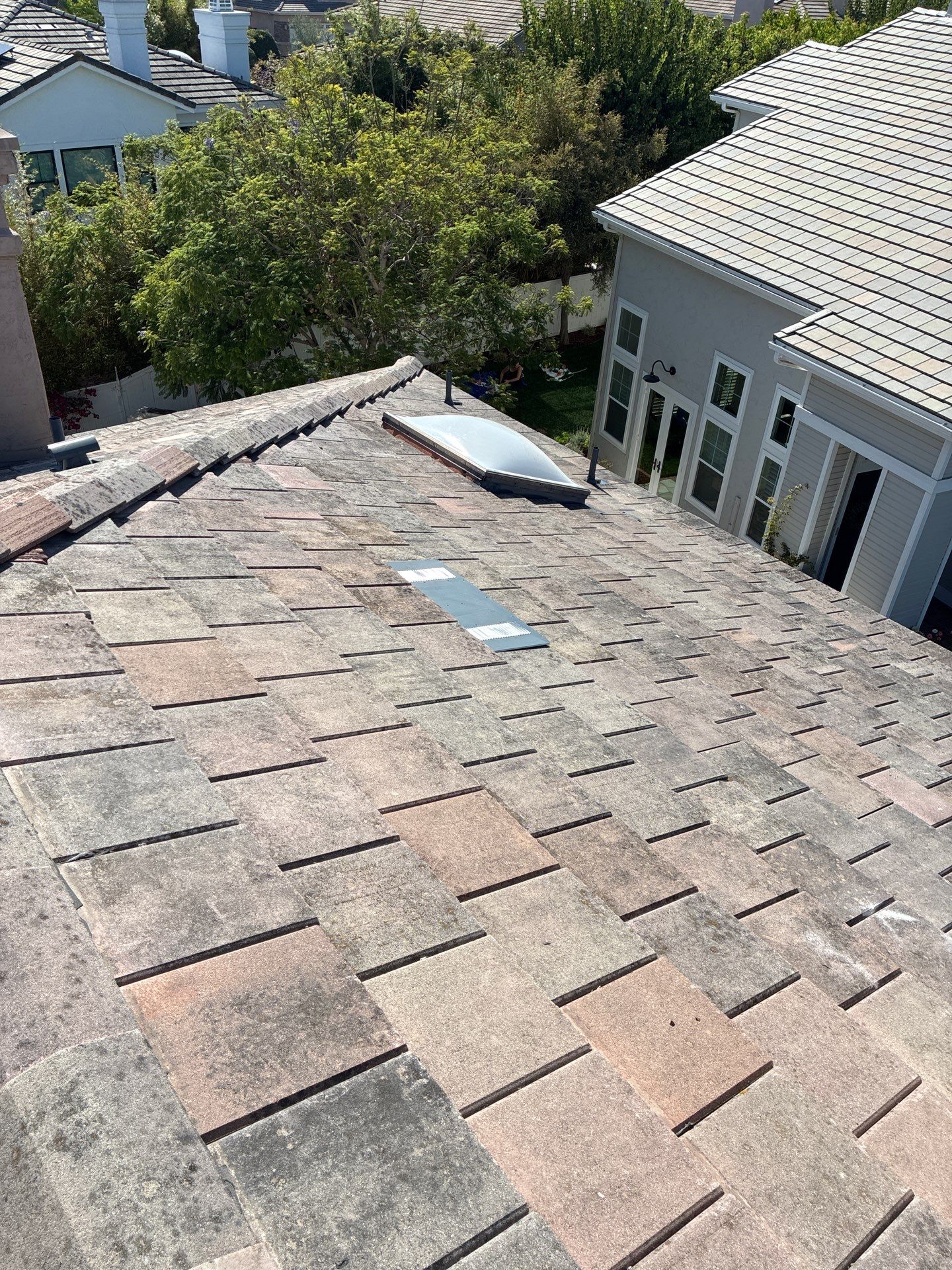 Carlsbad Concrete Tile Roof Replacement with Copper Flashing and Skylights by Reliable Roofing San Diego Inc.