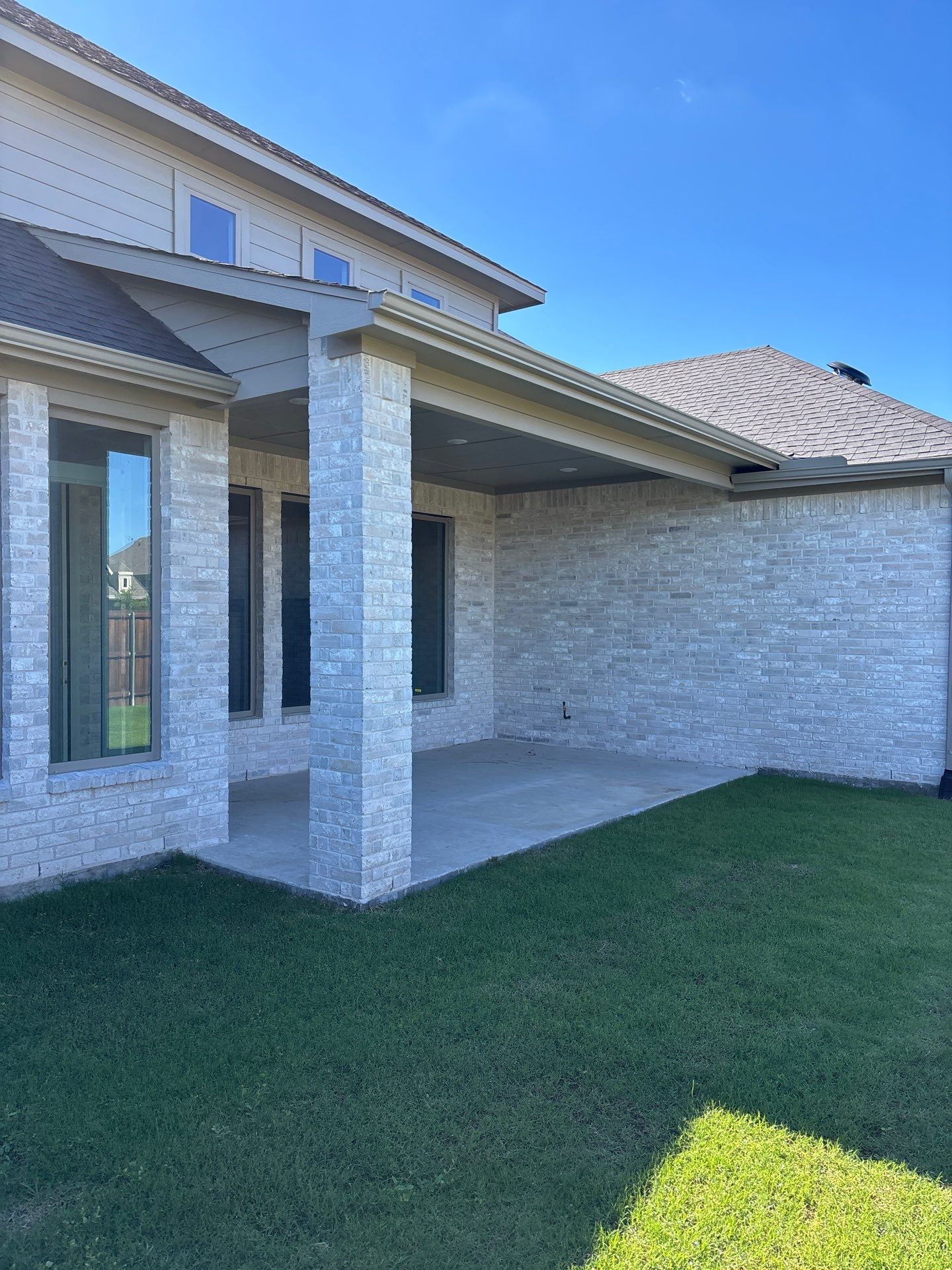 Year-Round Bonus Room: Patio Enclosure Featuring 16ft Seamless Sliding Glass by Tibi Soli LLC