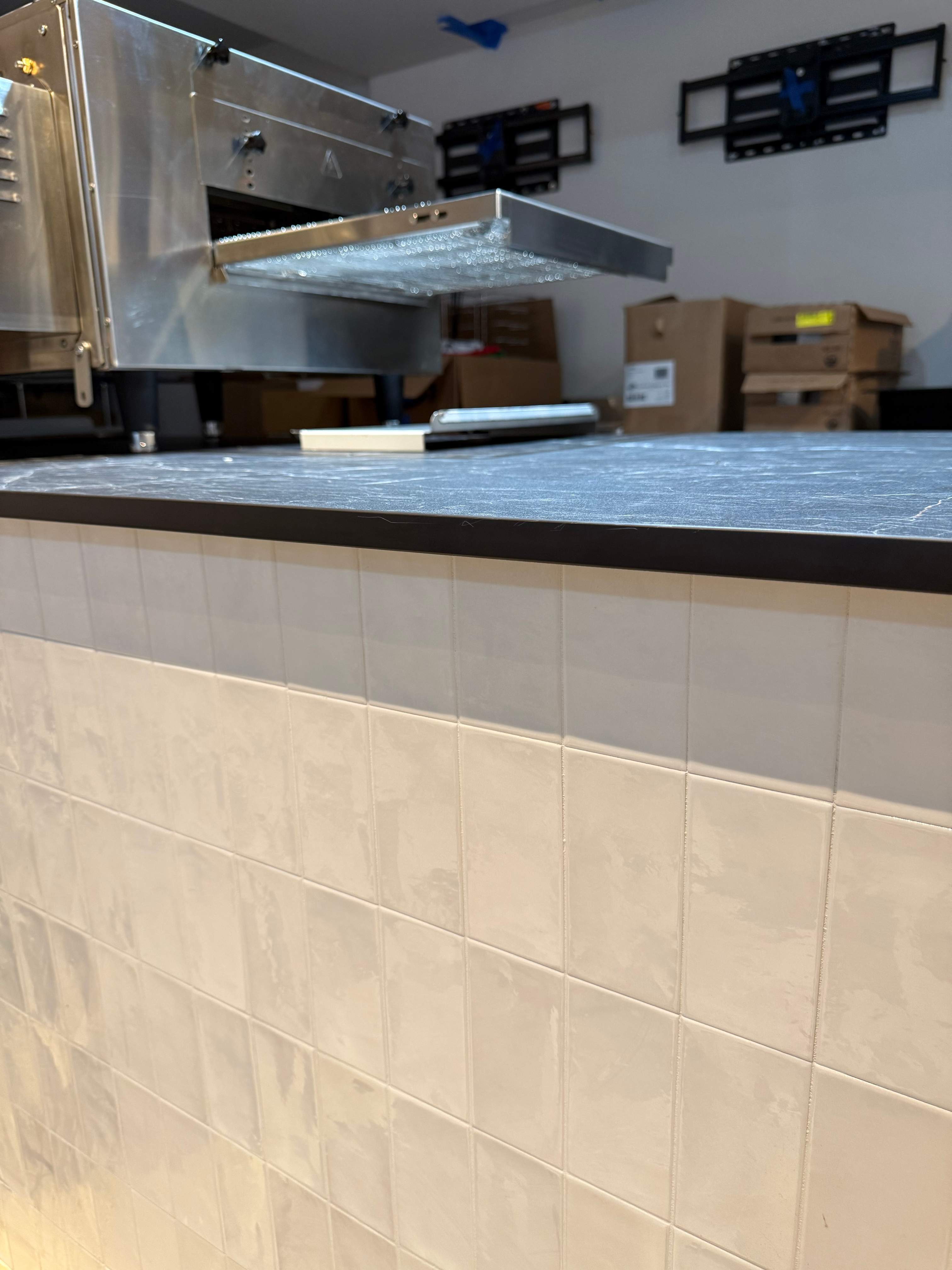 Sleek Glass Guard & Countertop Post Installation – Protest Pizza – Washington, DC by Capitol Iron Works