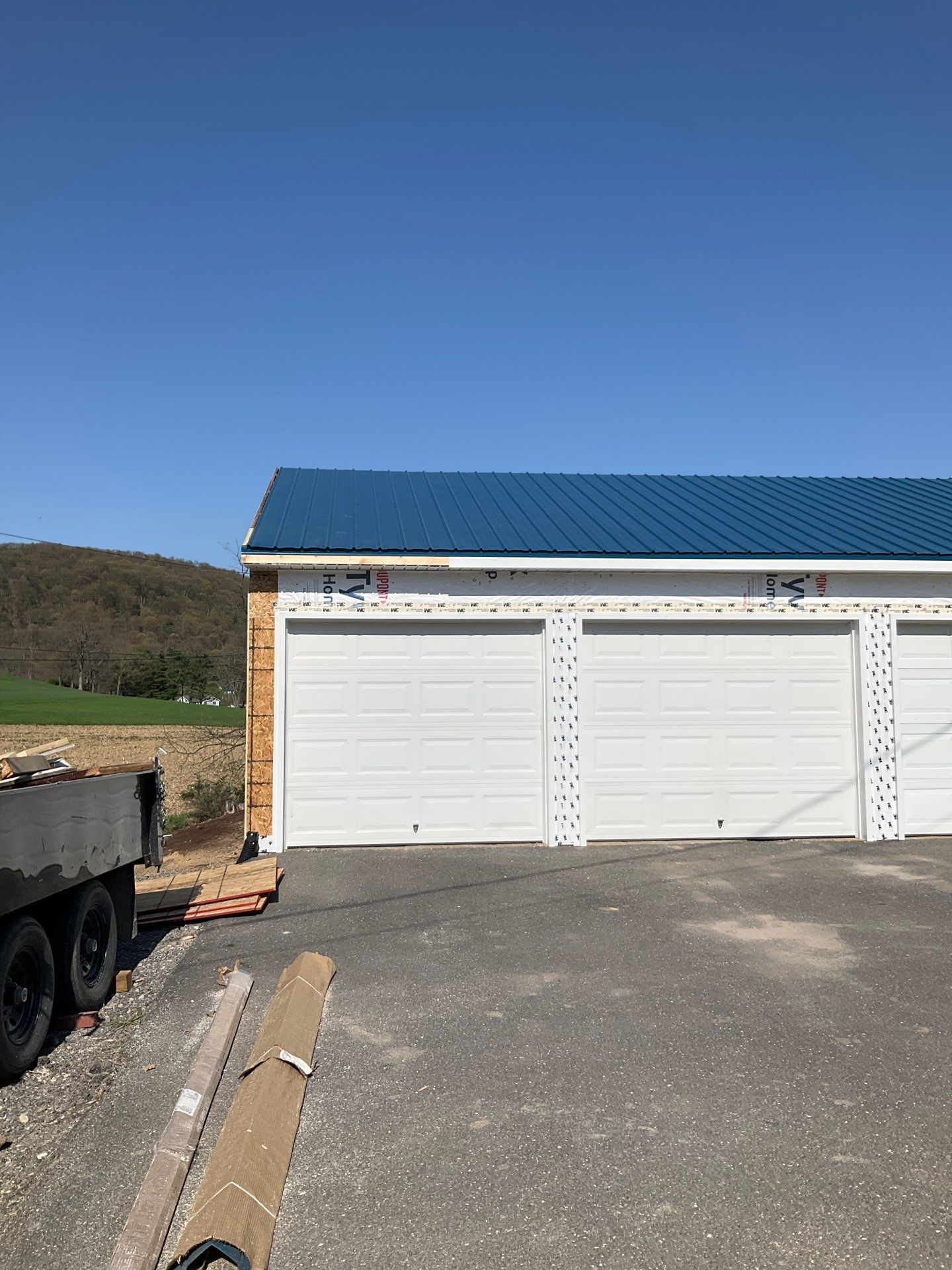 3-Car Garage refresh Blue Metal Roofing in Herndon by Esh Builders