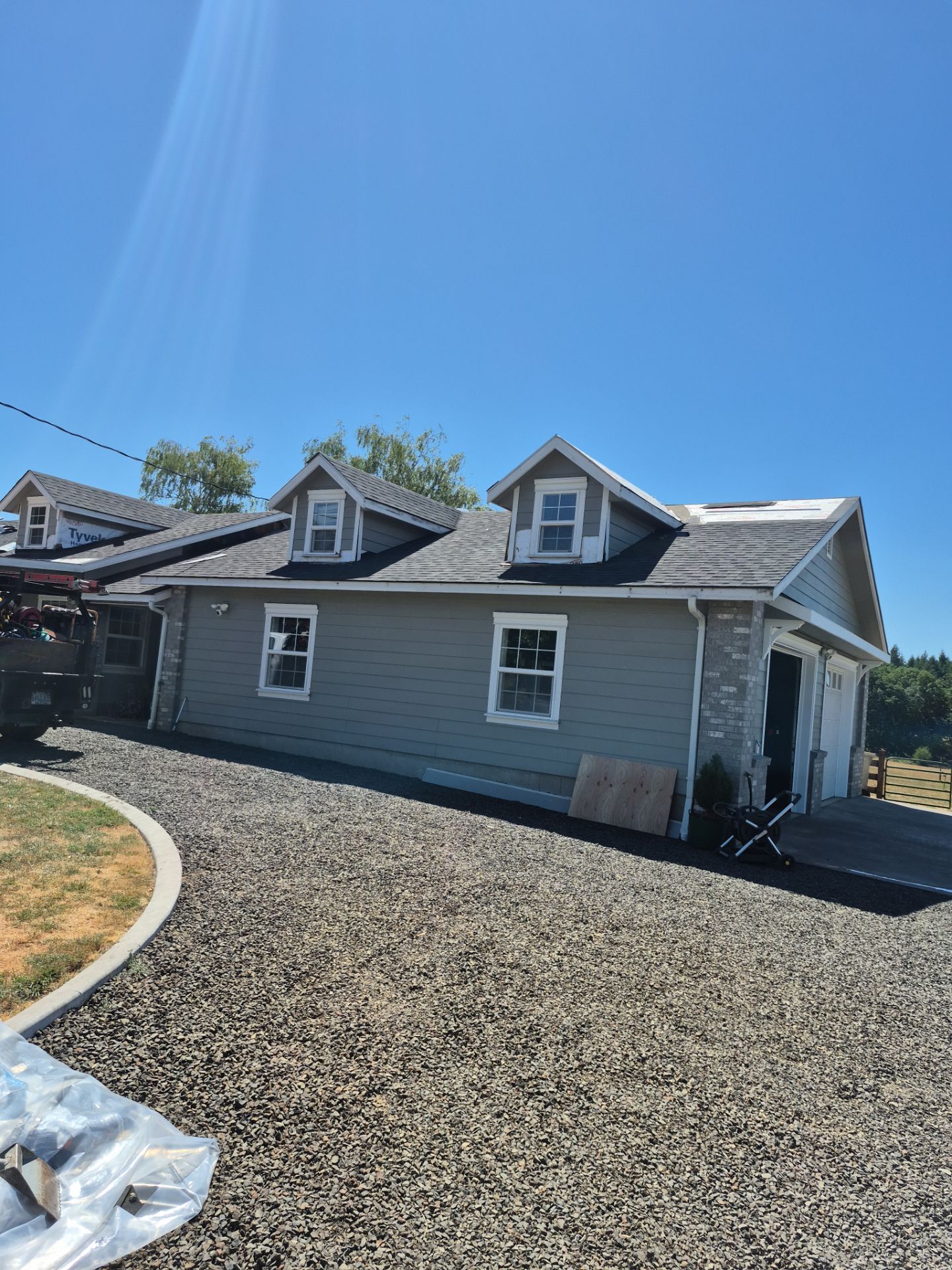 Residential Roof Replacement with Metal Accents by Orezona Building & Roofing Company, Inc.