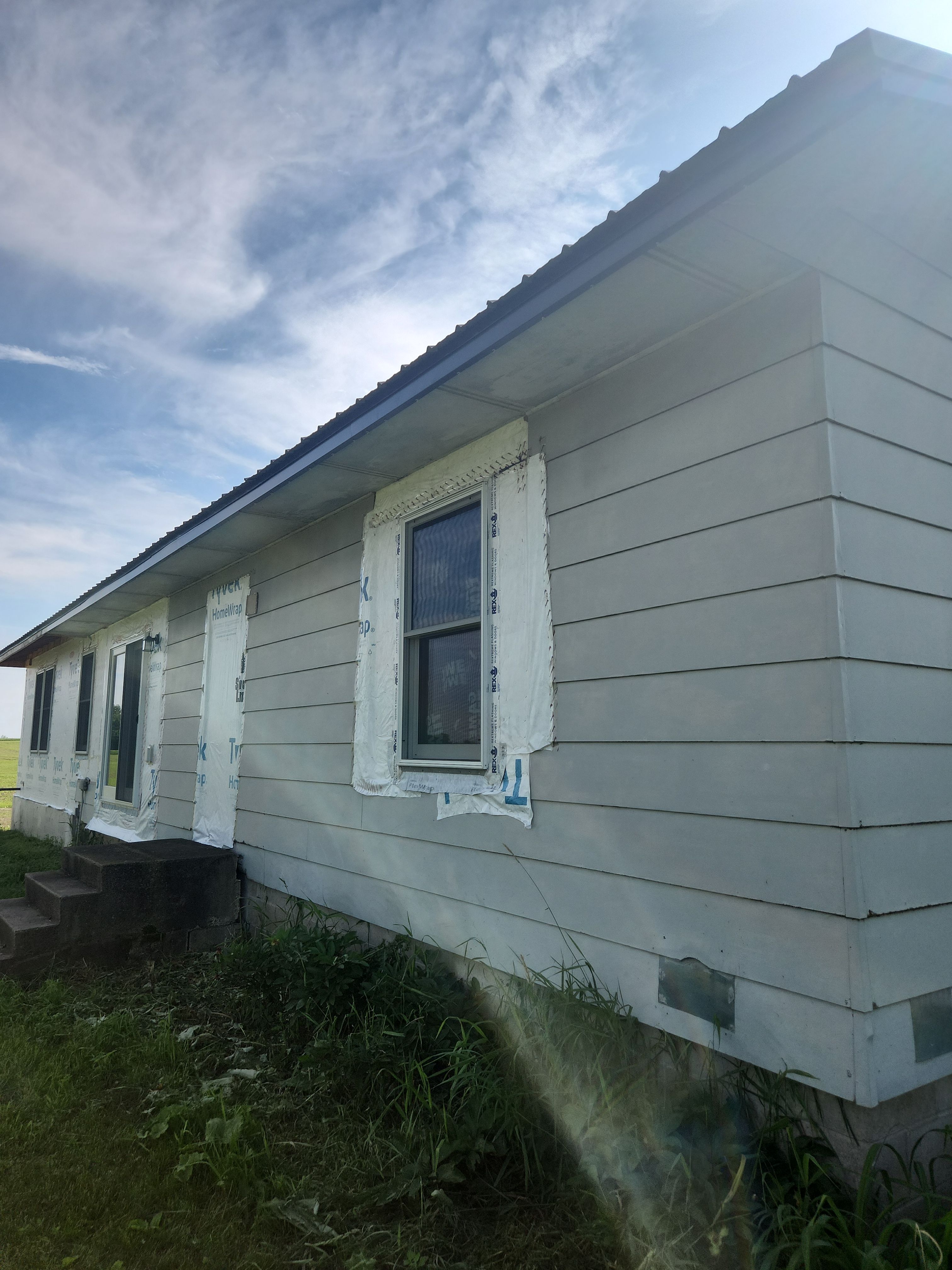 EDCO Steel Siding with Black Fascia & Soffit – Waverly, MN by Next Level Seamless Gutters / Exteriors Inc.