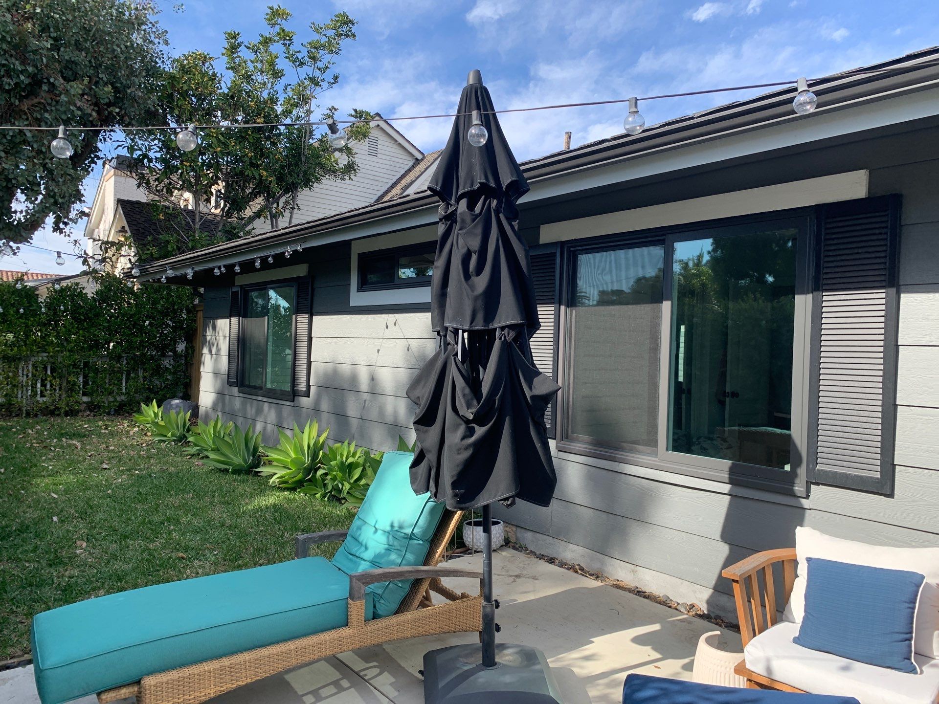 Window Installation using Milgard black vinyl windows by American Window Company