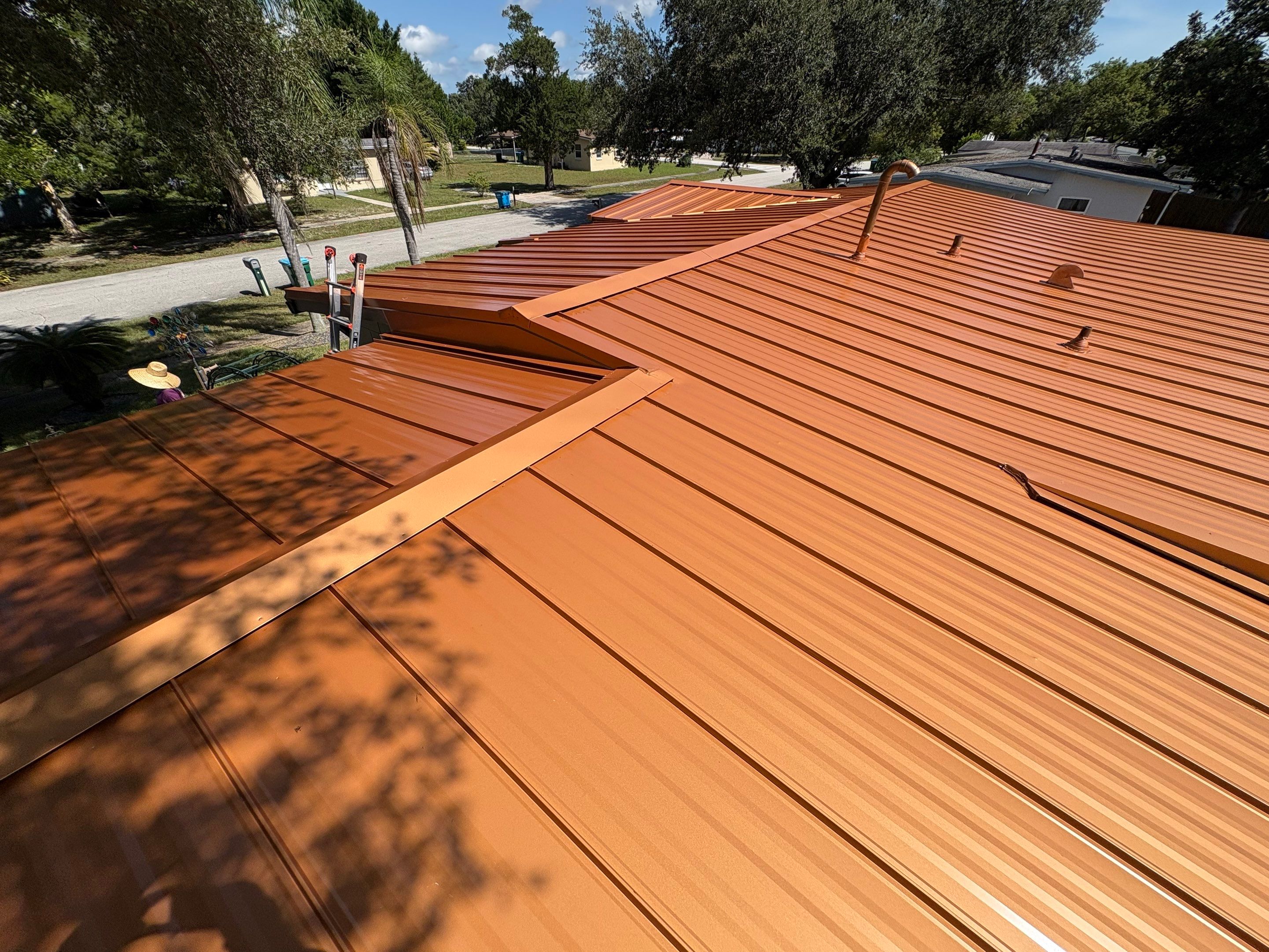 Standing Seam Metallic Copper Metal Roof Replacement in Deltona by Pinnacle Roofing Group