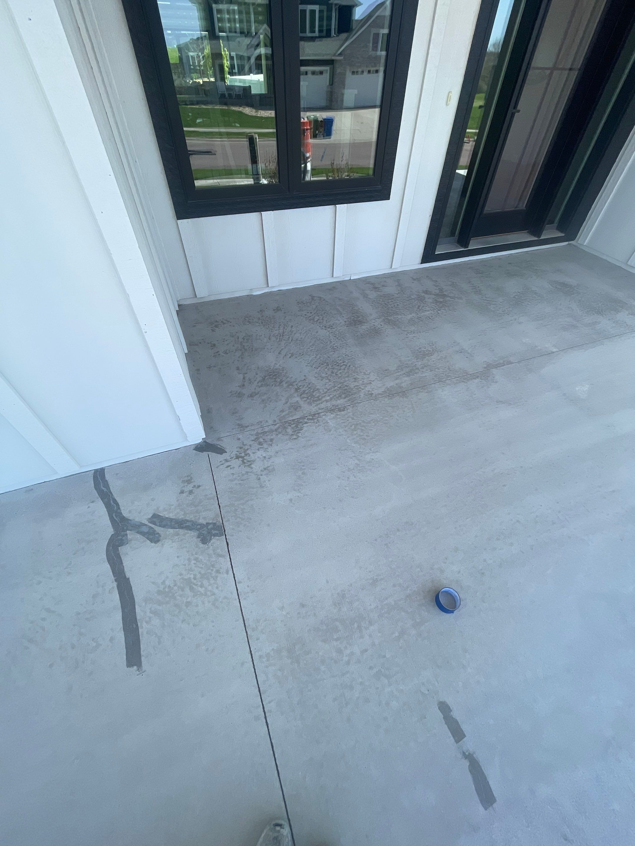 Grey Speckled Concrete Porch Coating for Sioux Falls Home by Select Painting, Coatings & Garage Cabinets