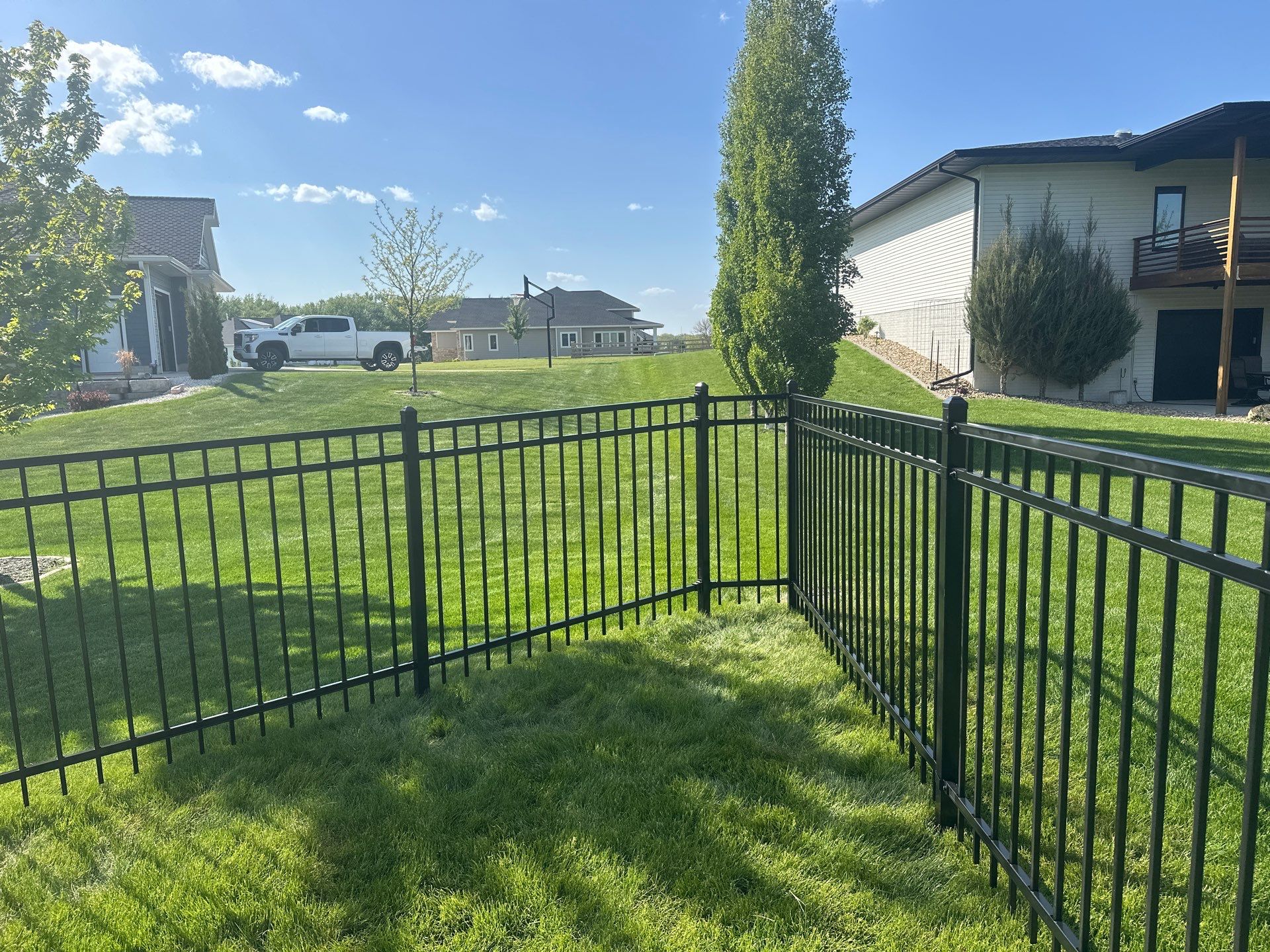 Black Ornamental Metal Picket Fence Installation in Waterloo by Perfect Picket Fence and Stain