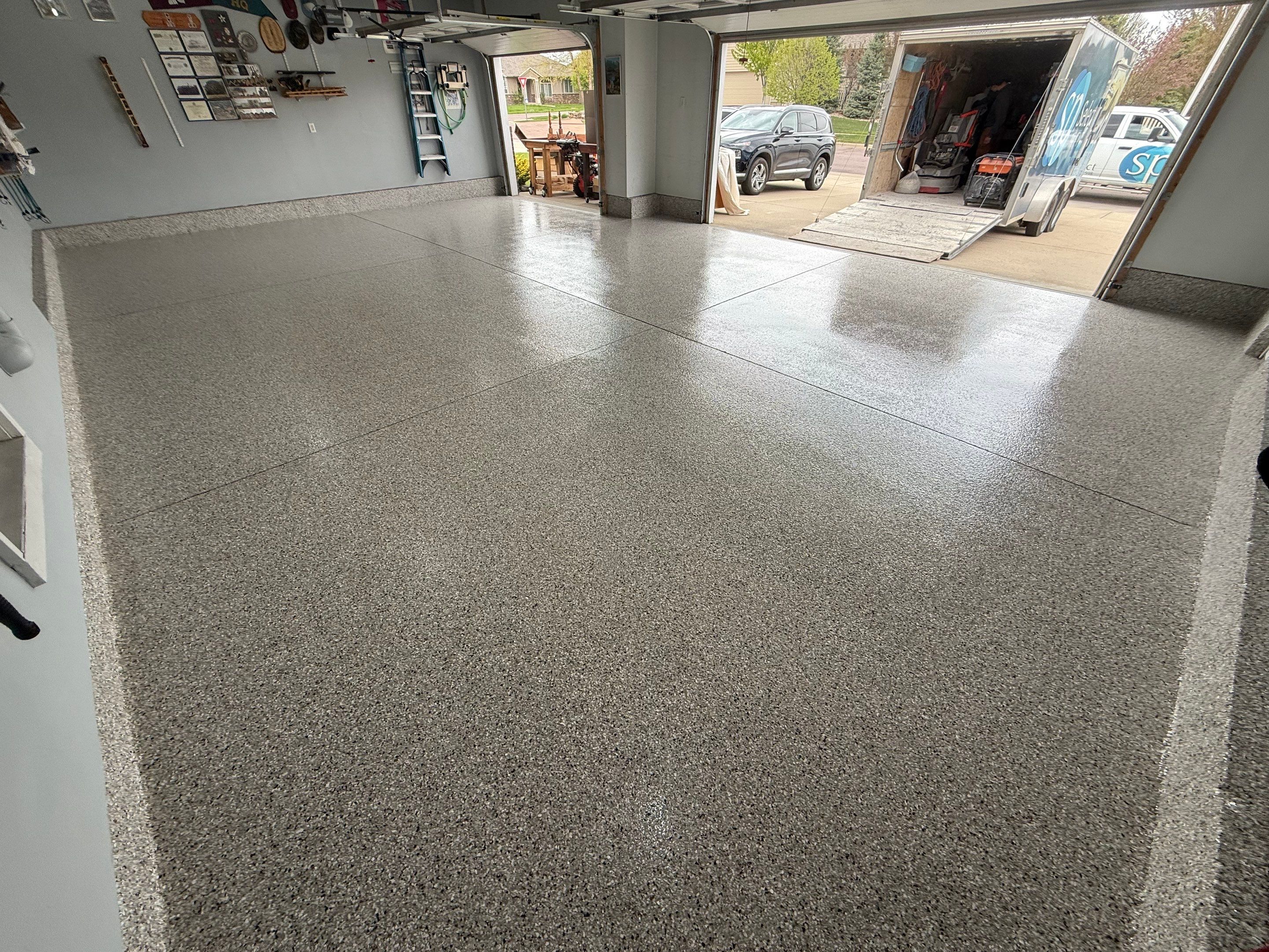 High-Gloss Epoxy Garage Floor Coating in Sioux Falls by Select Painting, Coatings & Garage Cabinets