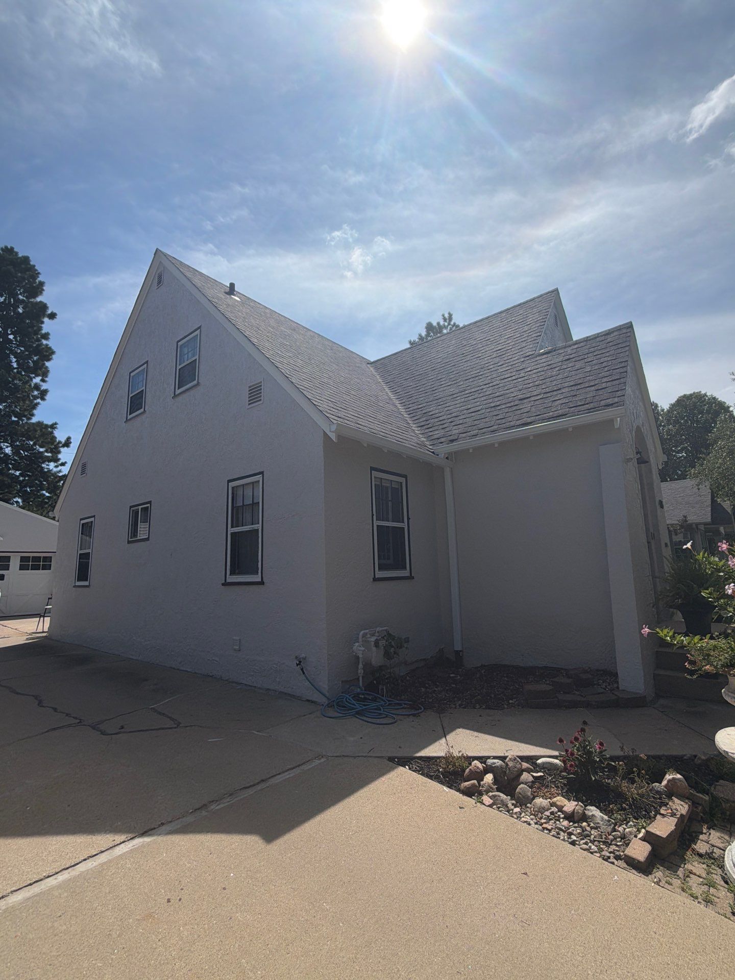 Exterior Stucco Painting and Trim Refresh in Sioux Falls by Select Painting, Coatings & Garage Cabinets