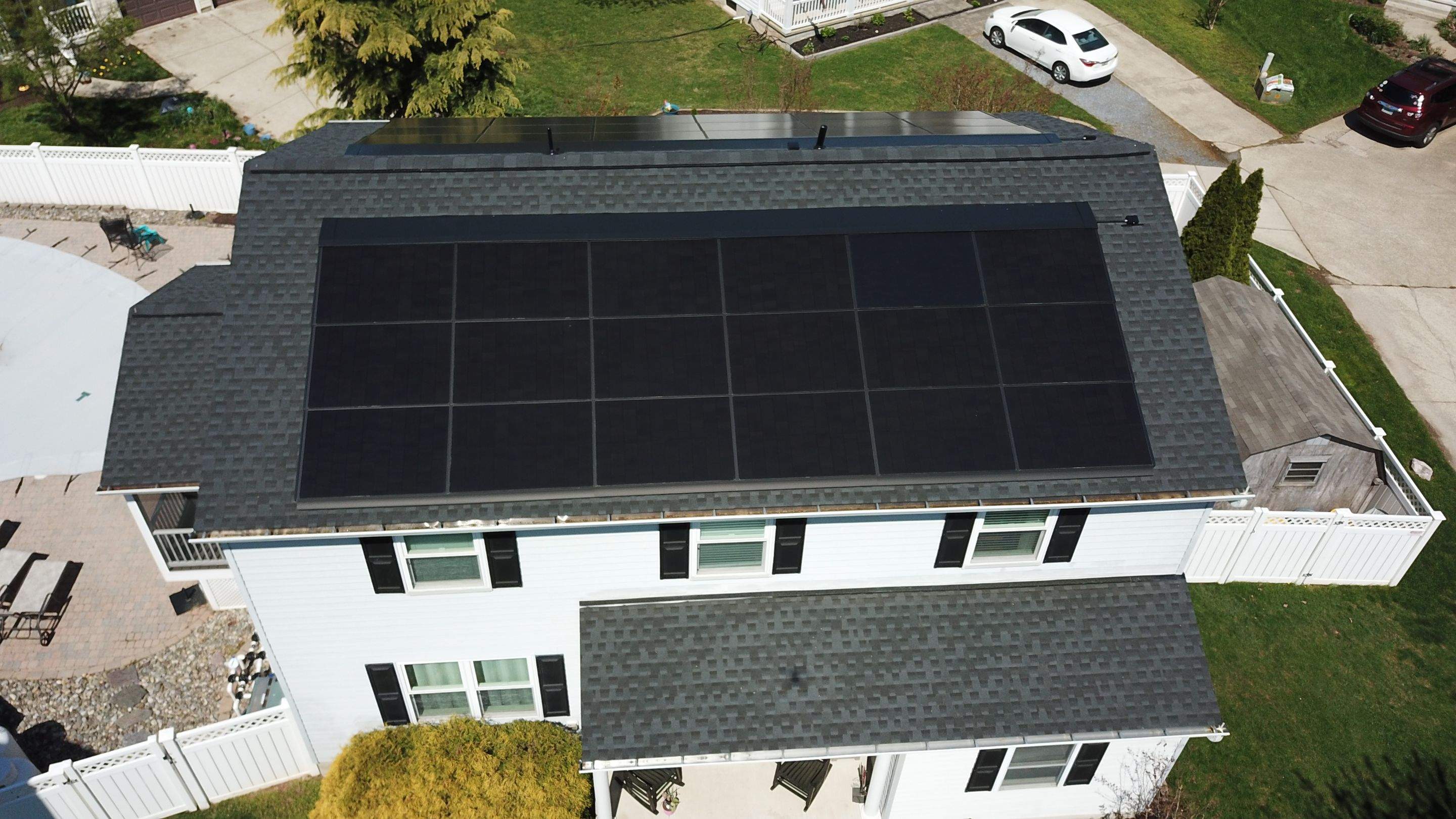 Roof Replacement with GAF Decotech integrated solar panels by American Home Contractors