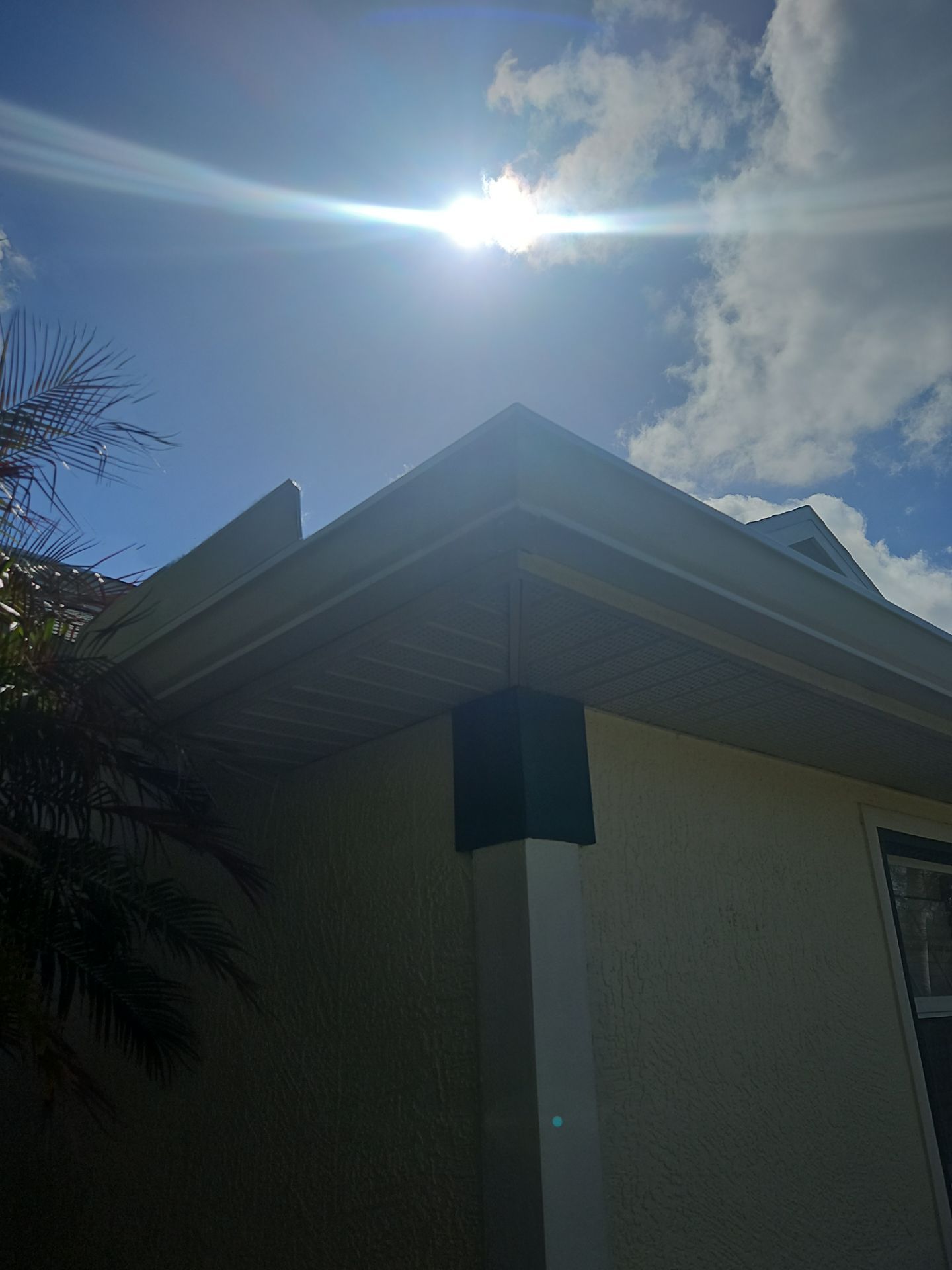 White seamless Gutters and downspout repair in Sarasota FL by Gutter Professors