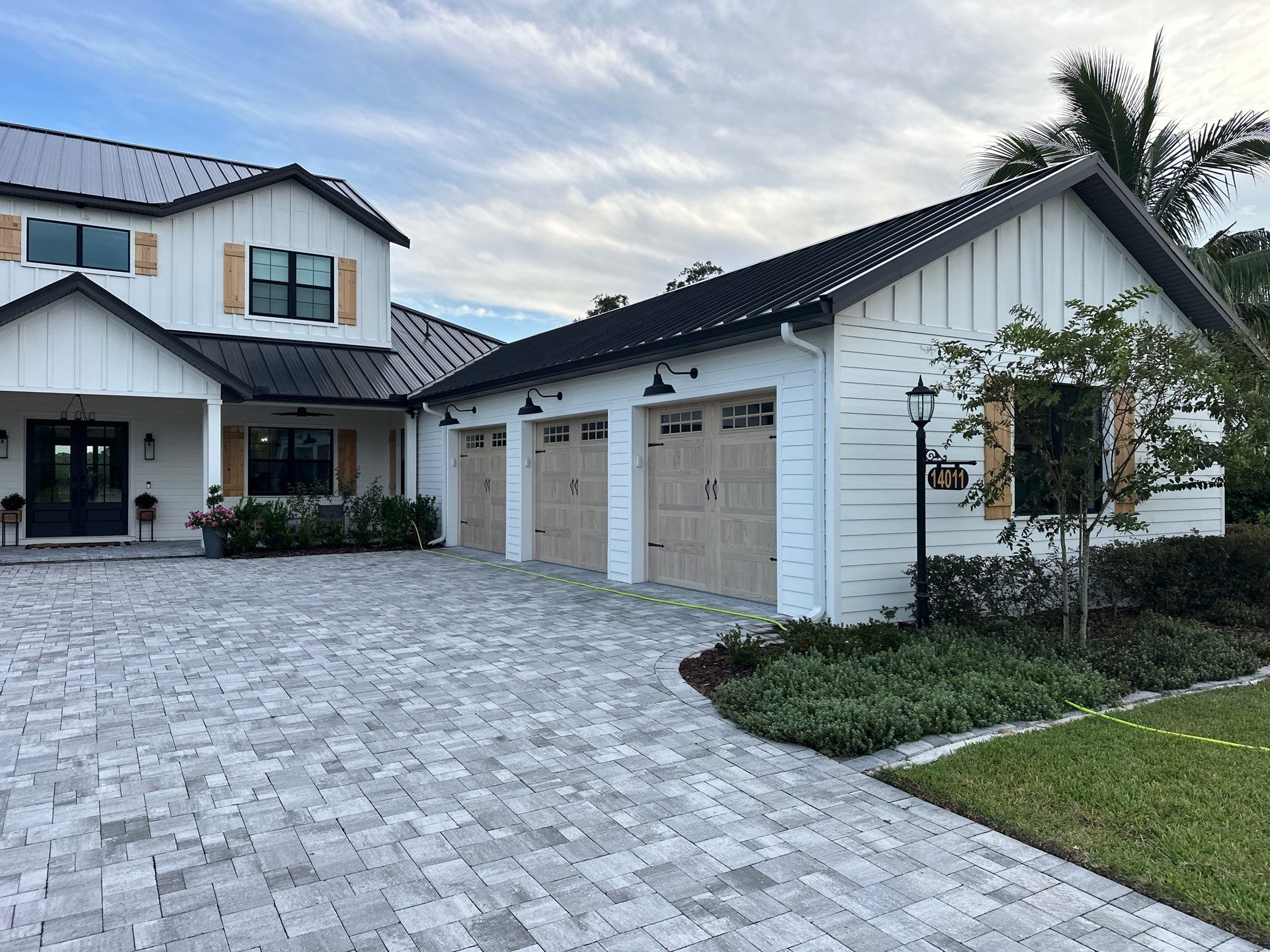 Complete Two-Story House Wash and Driveway Cleaning in Winding River Community, Bradenton, FL by Sunshine AquaWash