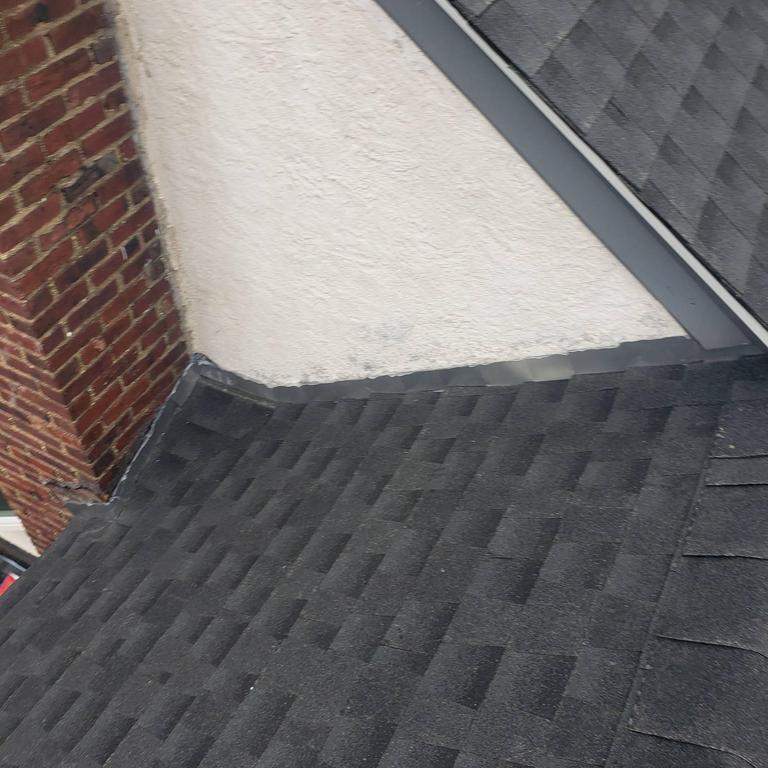 New Roof & Gutters by Island Roofing Inc.