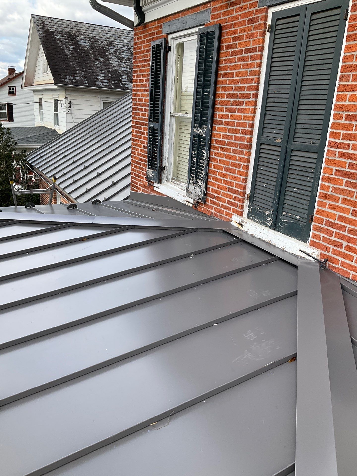 Updated Porch Roof with Clean Standing Seam Lines by Esh Builders
