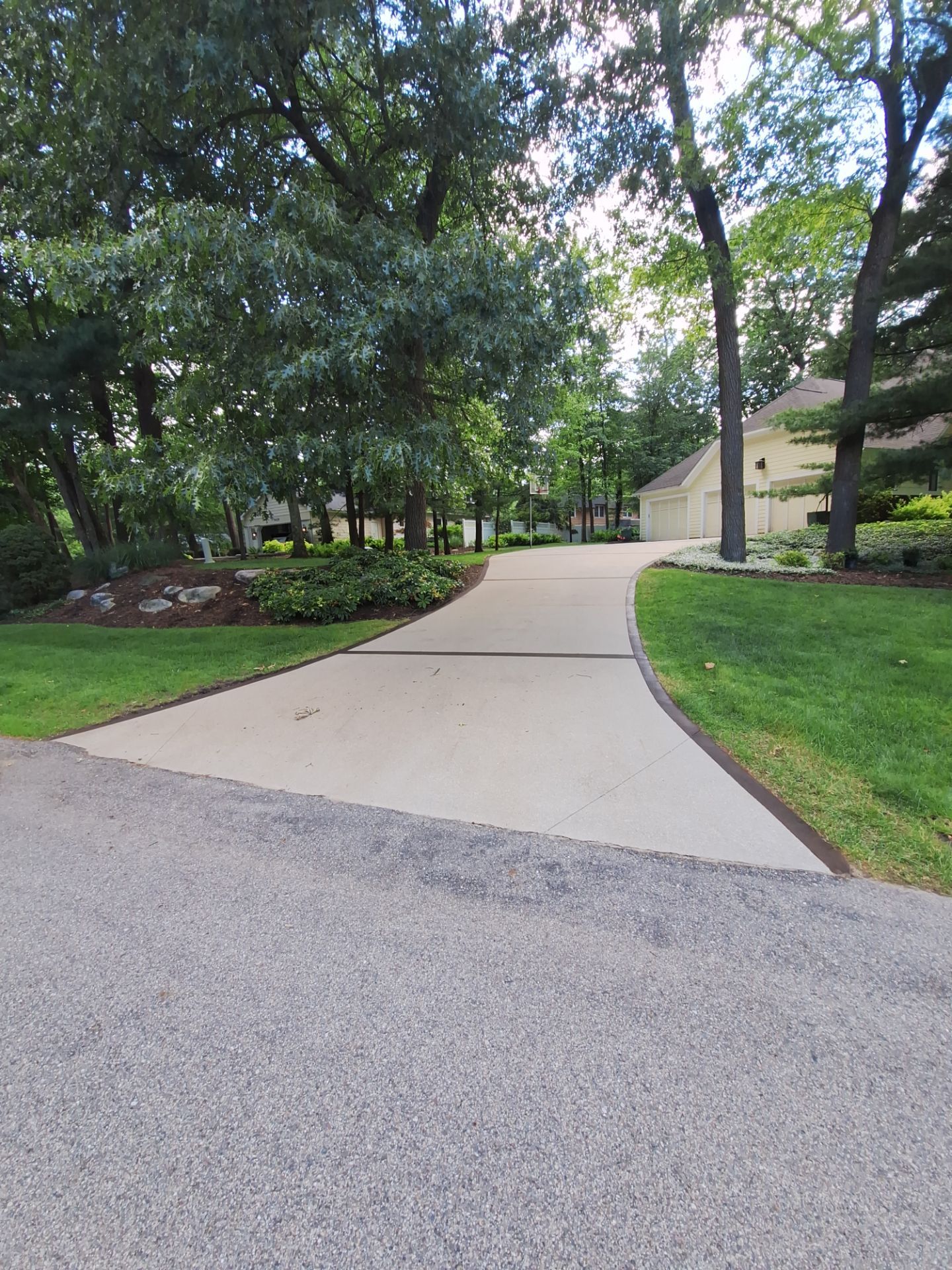 Concrete Driveway and Walkway Staining With Espresso Borders in Grand Rapids by Gordon Painting