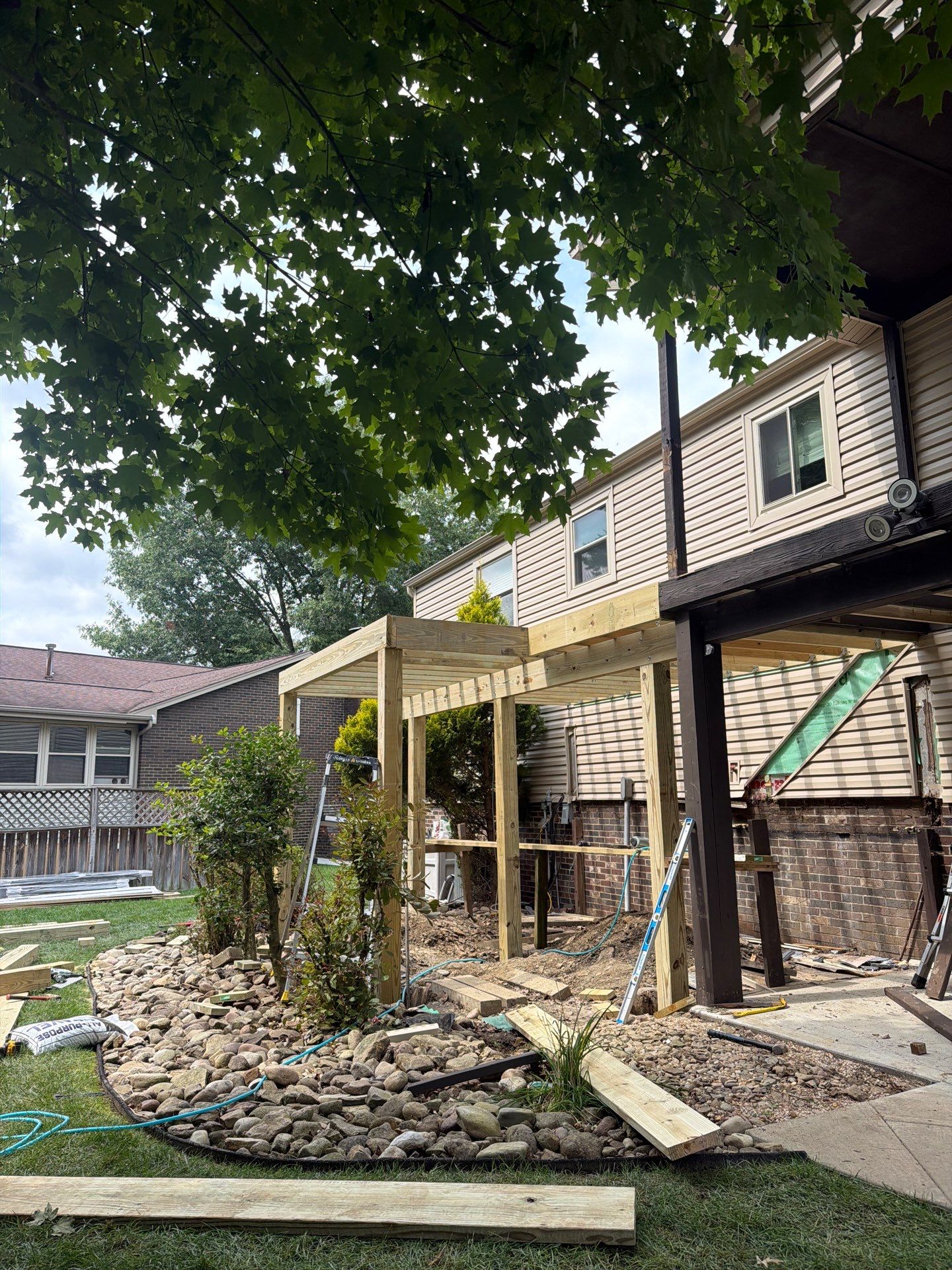 Elevated Composite Deck Installation with Covered Porch in South Park Township by Cousins Roofing Siding & Decks