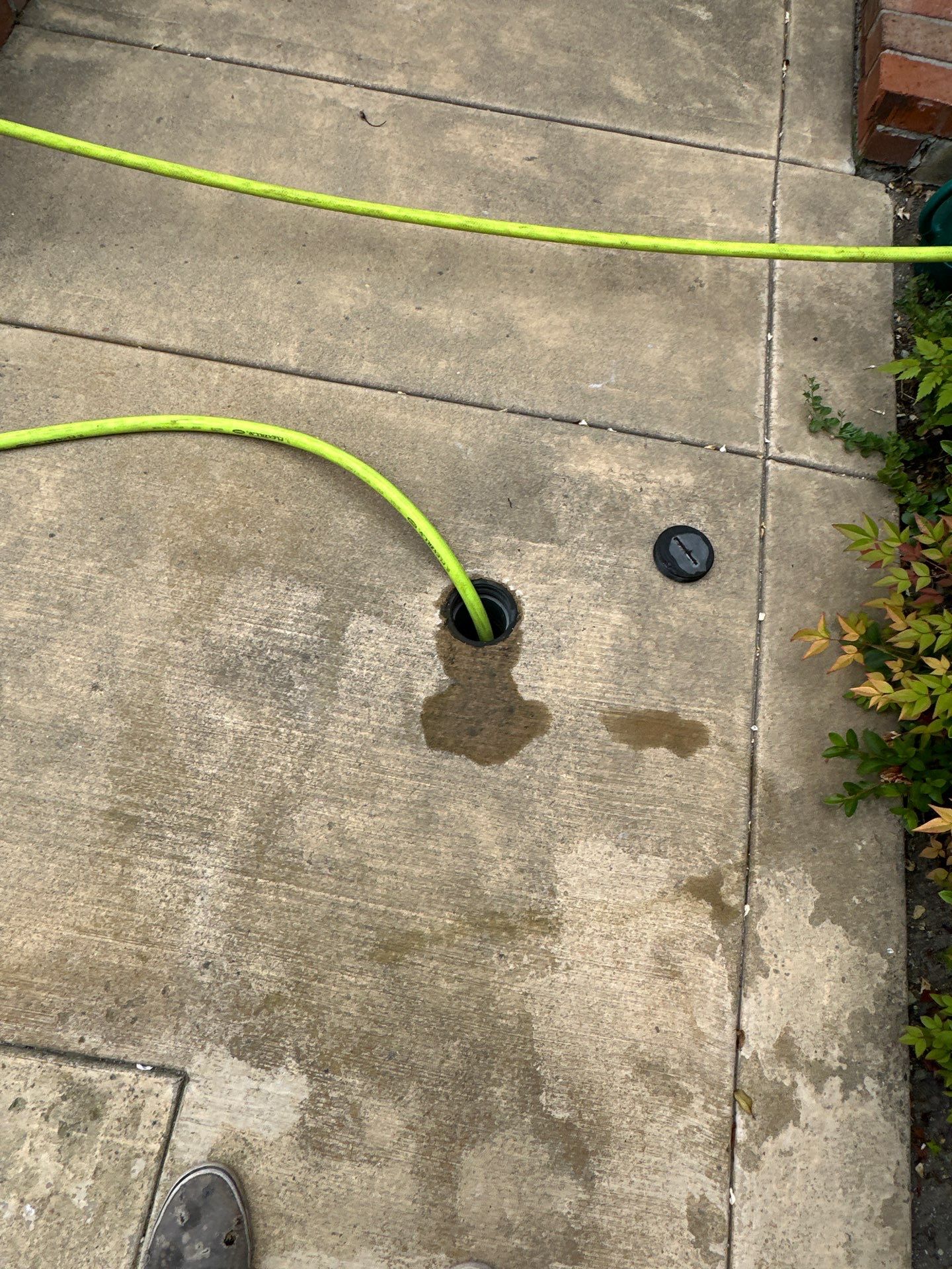Driveway, patio, and rear entry walkway pressure washing in Orange County by Property Cleaning Experts