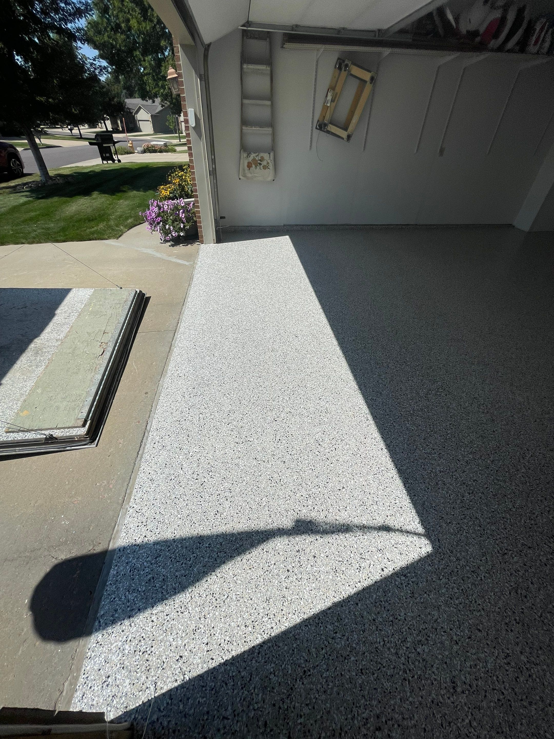 Sioux Falls Residential Garage Floor Coating with Speckled Epoxy Finish by Select Painting, Coatings & Garage Cabinets