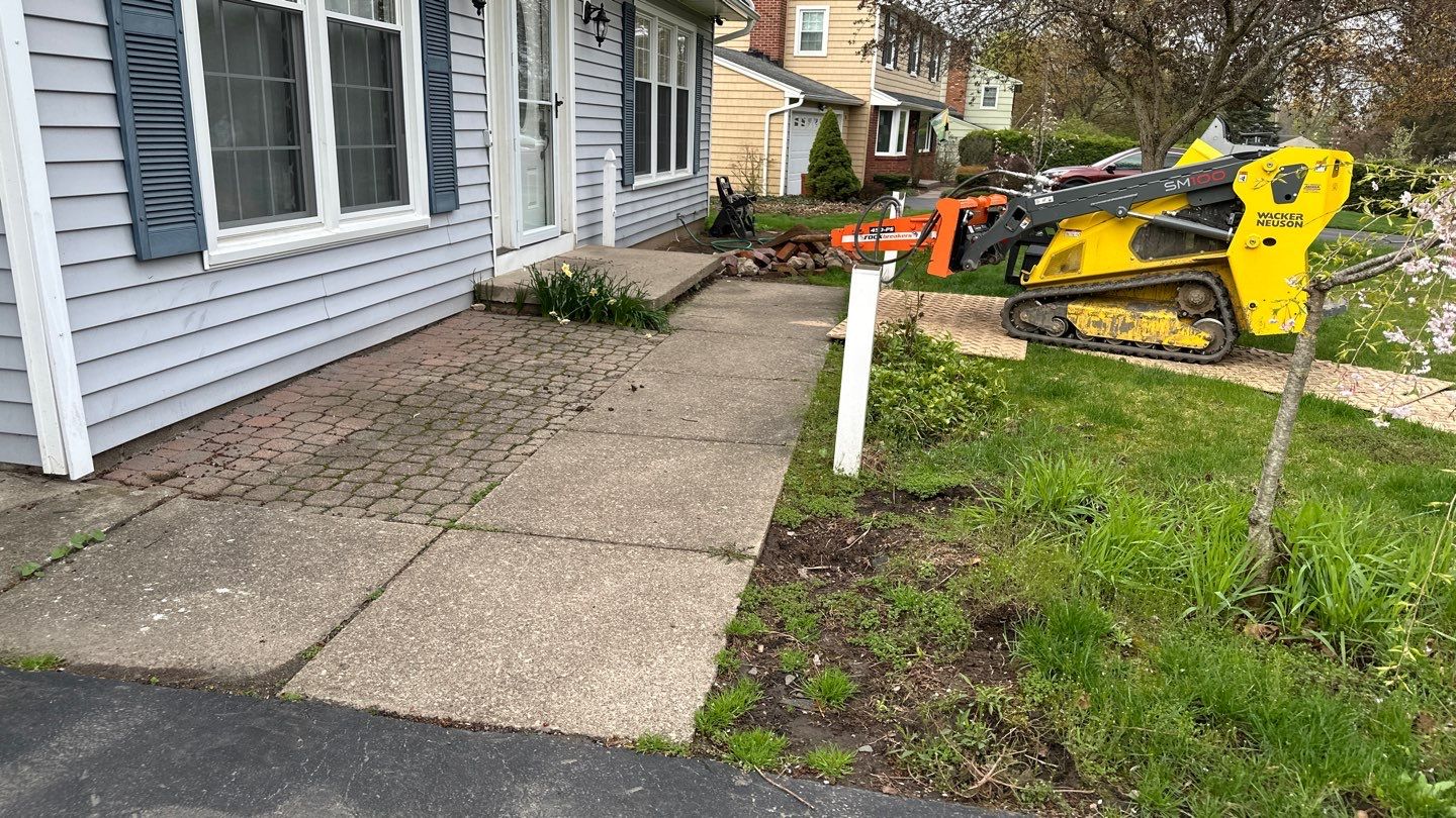 Broom finished front patio  by NG Masonry & Construction LLC