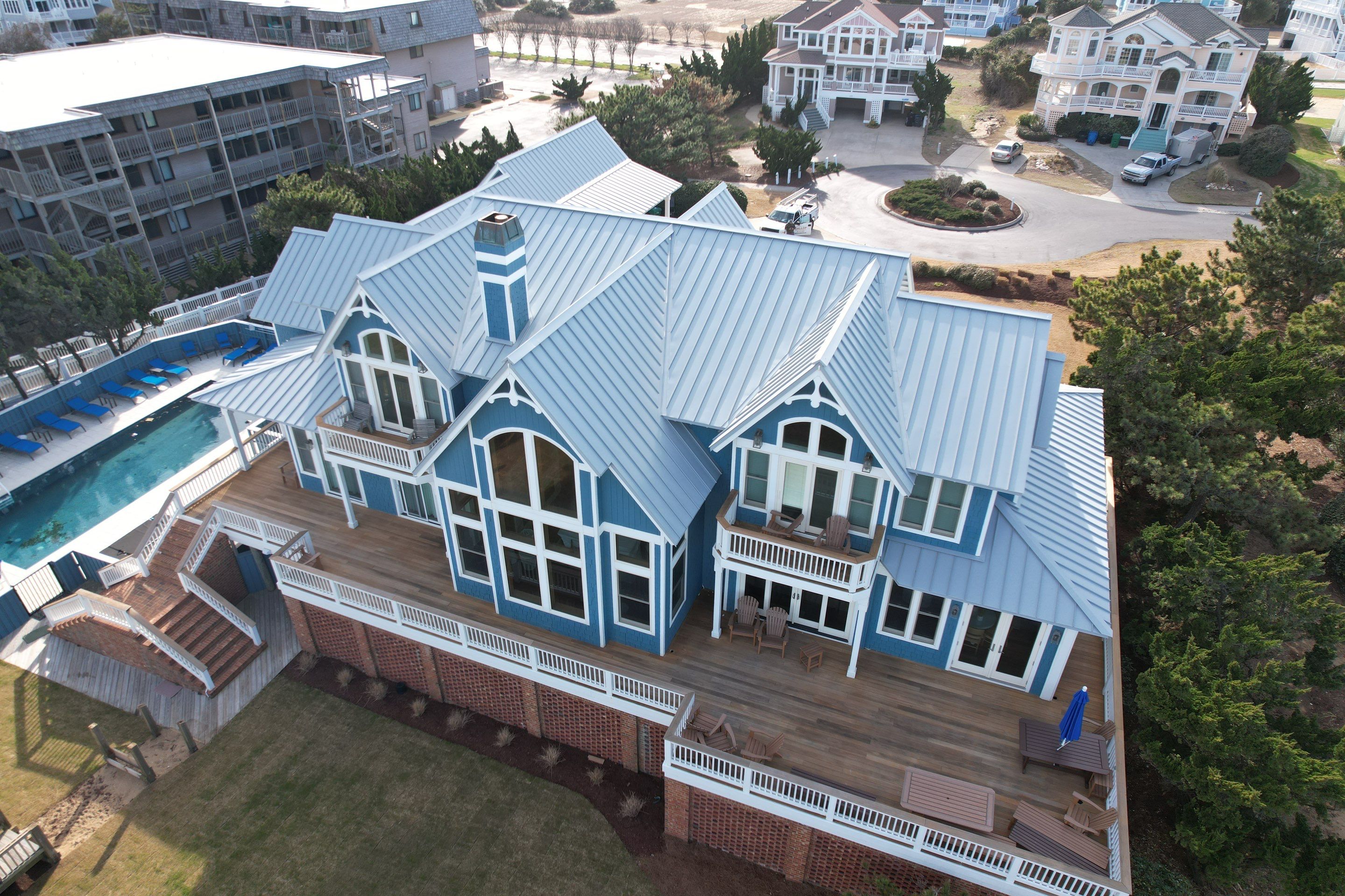 Large Metal Roof Transformation by Gallop Roofing & Remodeling, Inc.