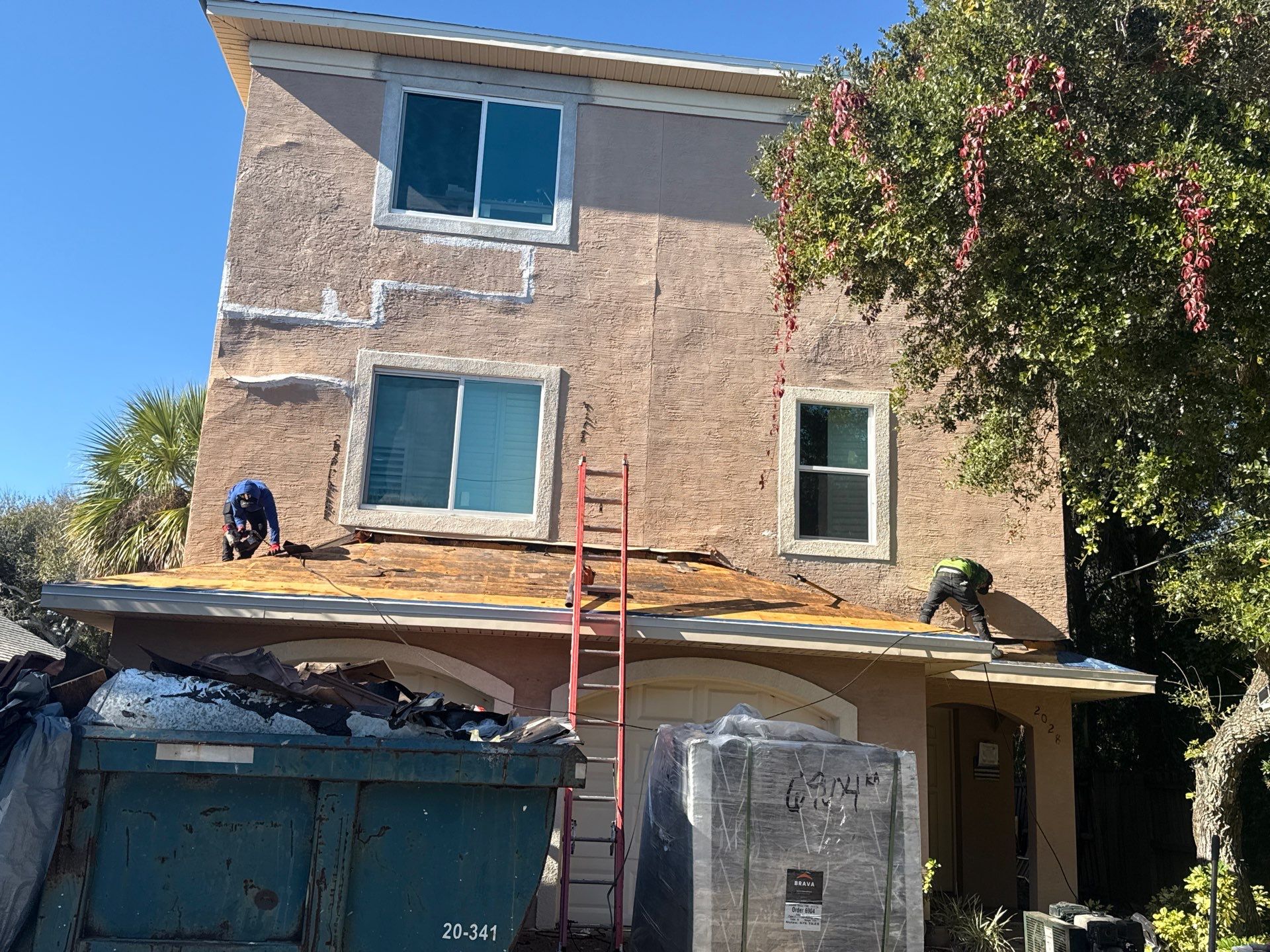 Flagler Beach Residential Tile Roof Replacement with Dark Barrel Tiles by Fortified Roofing Solutions Corp.