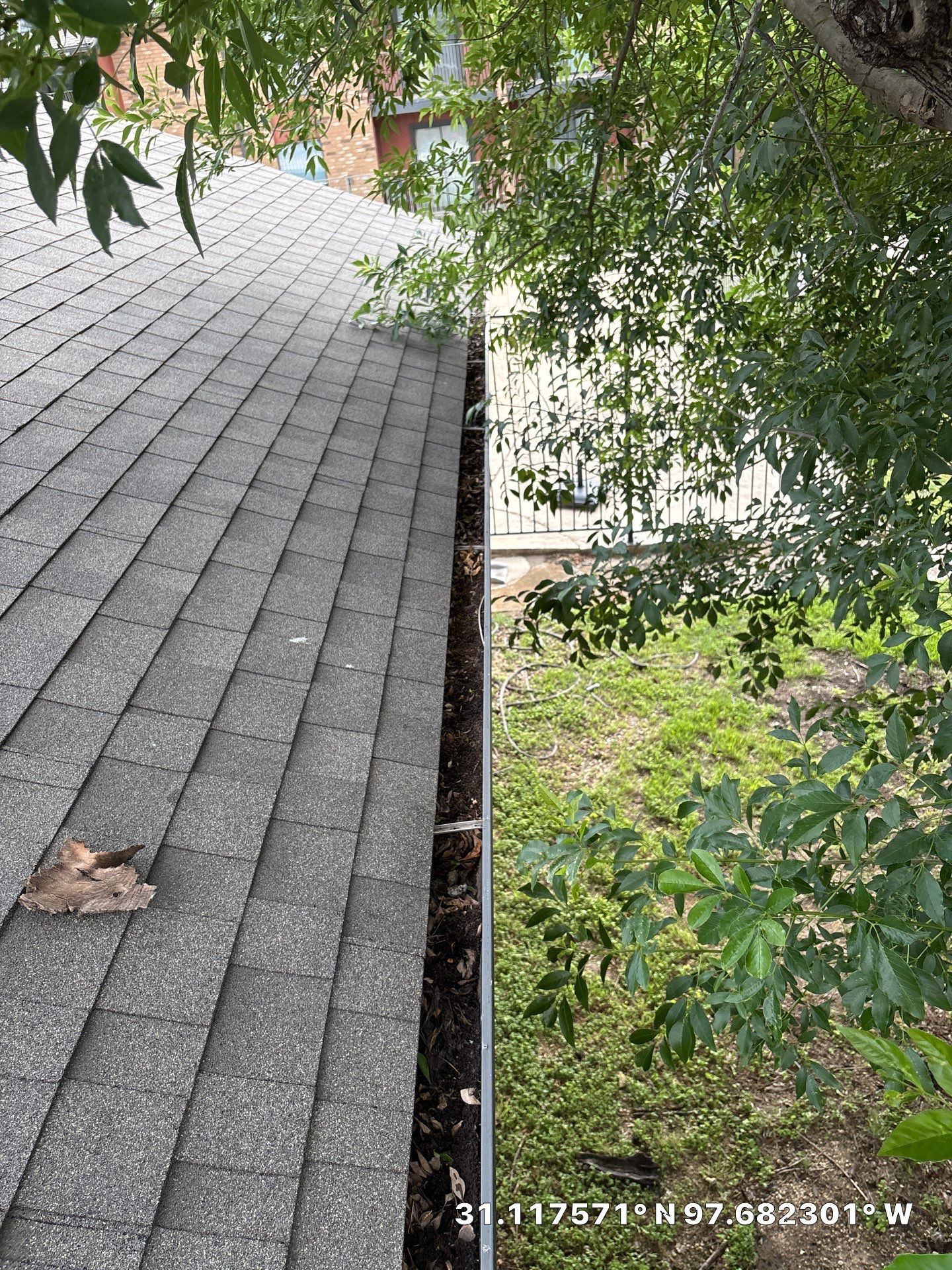 Commercial gutter cleaning Killeen & Temple before photo with filled gutters