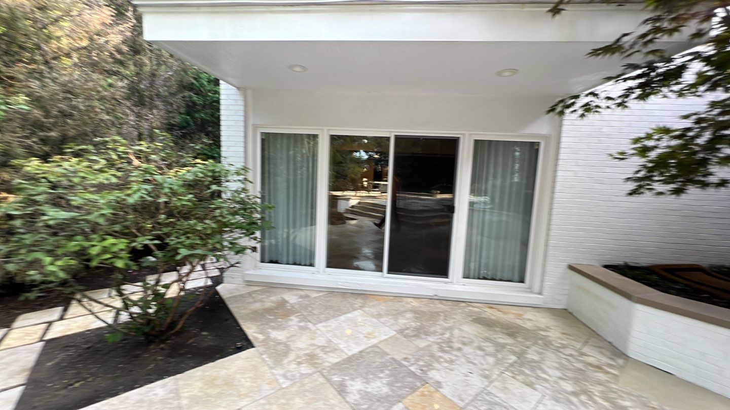 marble patio cleaning and sanding using Polysweep polymeric sand by Northern Power Washing LLC.