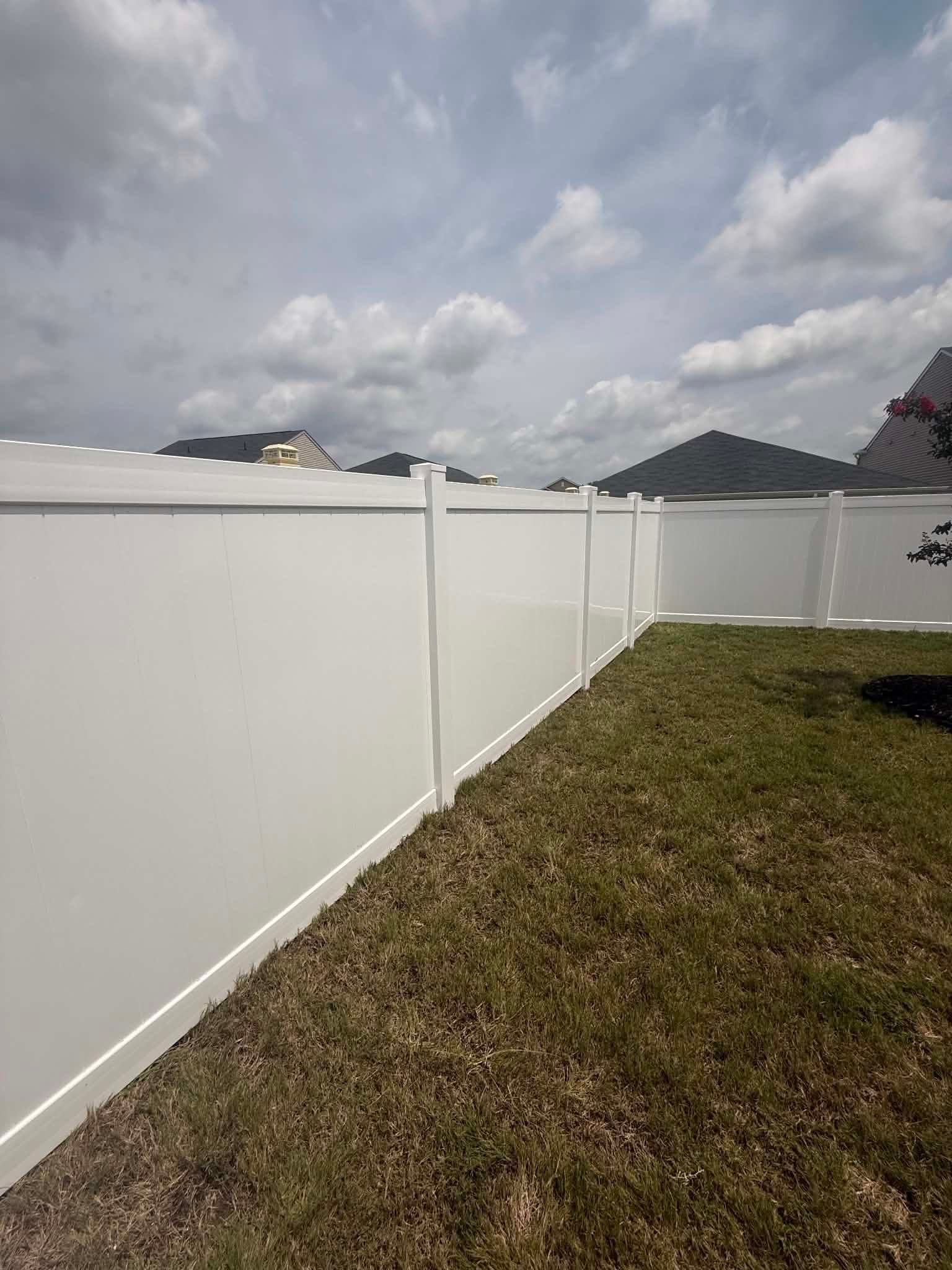 Vinyl Privacy Fence Installation for Greenville Residence by Superior Fence and Rail