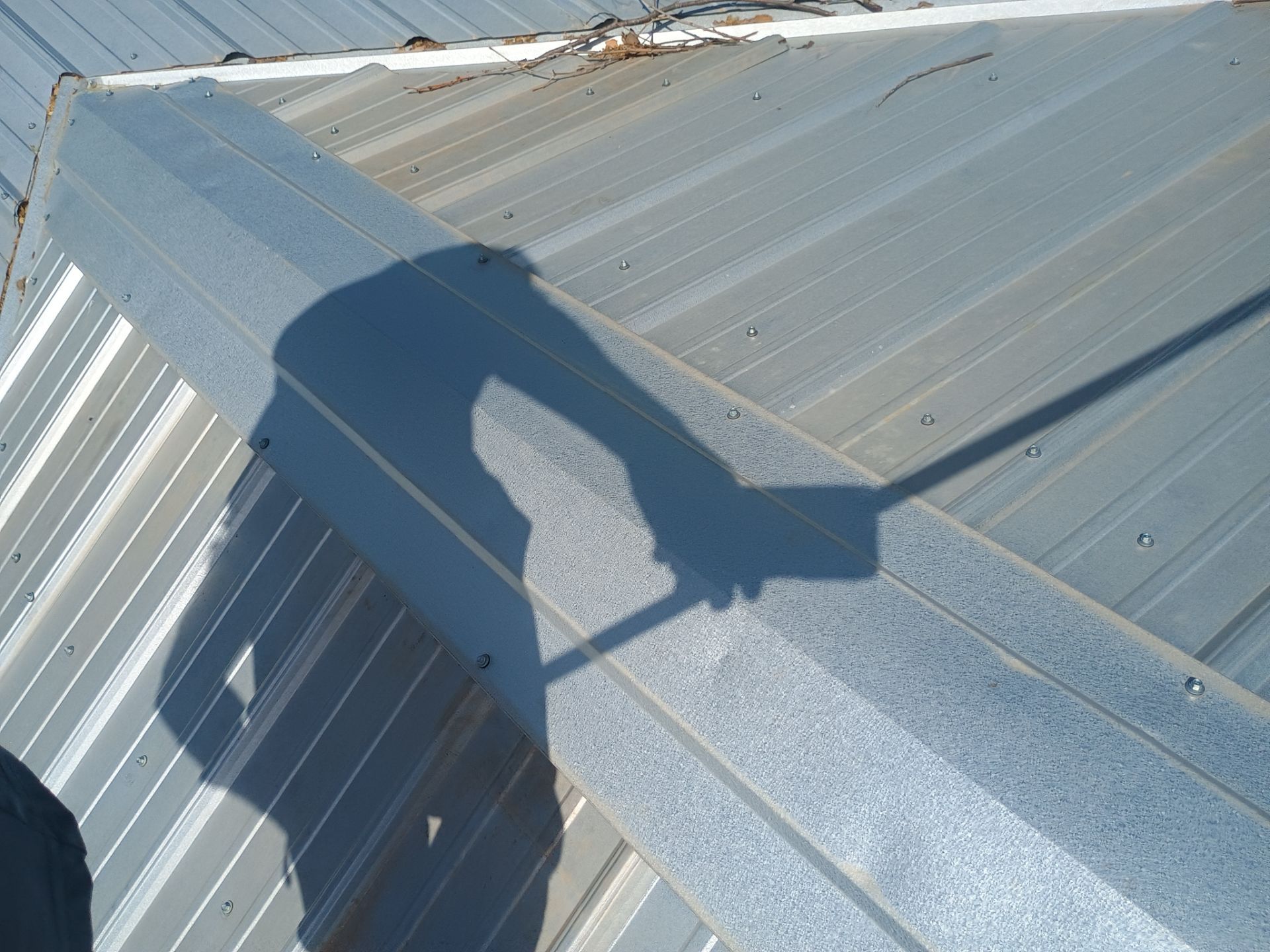 Corrugated Metal Roof Repair for Brick Home in Lindsay by BANA Roofing and Solar Supply