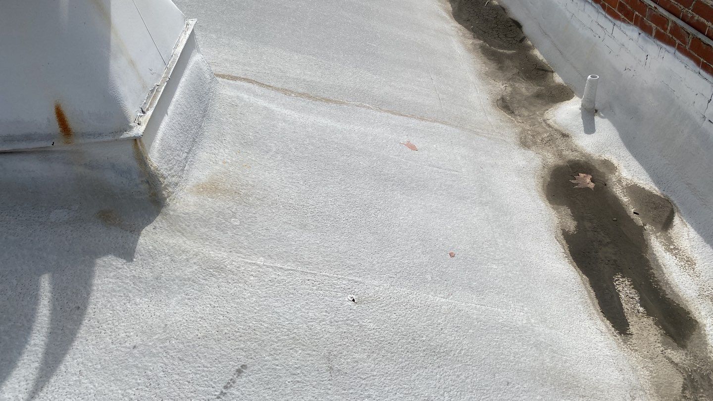 Polyurethane foam roof refurbish and recoating by Straight Edge Roofing Inc