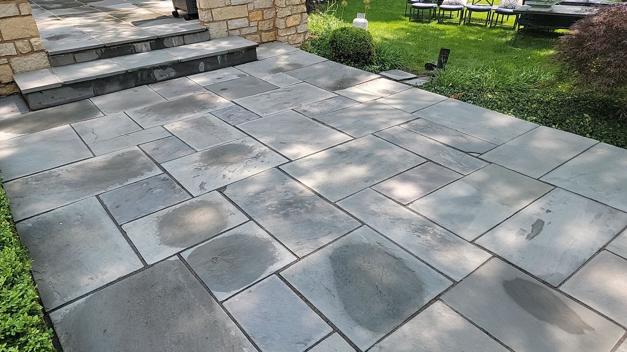 Northbrook, IL stucco home soft wash and stone cleaning by Northern Power Washing LLC.